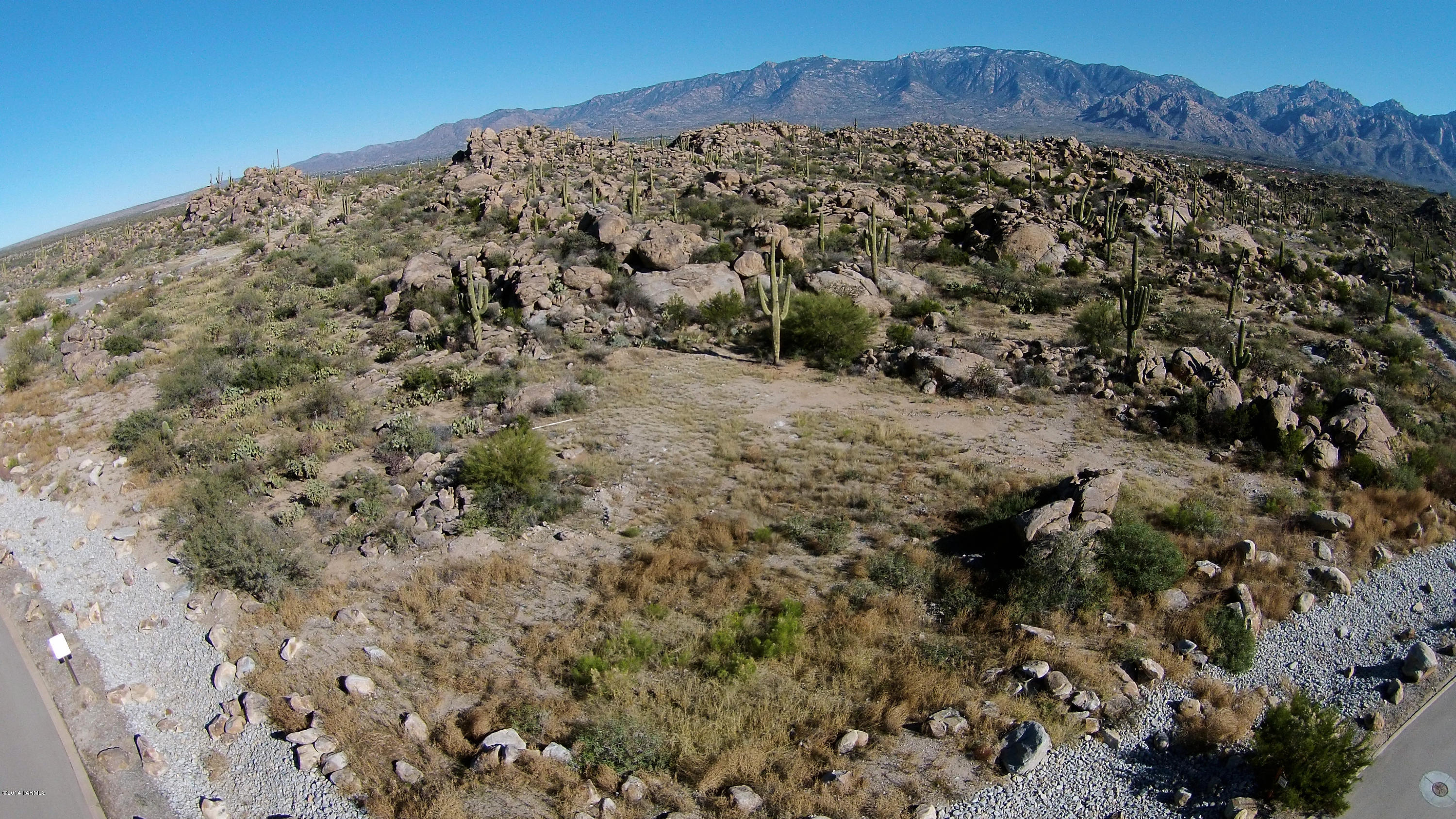 PERFECT CORNER LOT IN THE EXCLUSIVE GUARD GATED COMMUNITY STONE CANYON. MAJESTIC ROCK OUTCROPPINGS, TORTOLITA AND CATALINA MOUNTAIN VIEWS. VERY EASY TO BUILD ON, FLAT. COME SEE THIS AMAZING LOT TODAY. THE STONE CANYON CLUB, OWNED BY PHIL MICKELSON IS A PRIVATE GUARD-GATED LUXURY RESIDENTIAL GOLF COMMUNITY RANKED #33 IN GOLFWEEKS TOP 100 RESIDENTIAL GOLF COURSES IN 2015. THIS CUSTOM SITES OFFERS PRIVACY, OUTSTANDING VIEWS & ENDLESS ARCHITECTURAL DESIGN OPTIONS. BUILD WHEN YOU ARE READY AND ENJOY THE PHENOMENAL LIFESTYLE NOW.