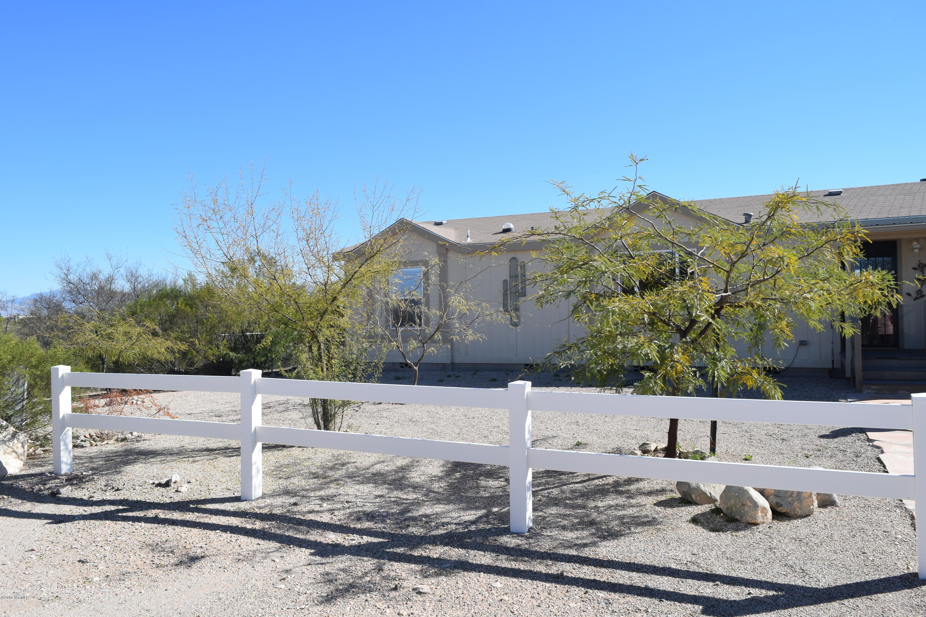 Welcome Home! Tranquility and Beauty of the Desert surround you. Well maintained home with new Shaw floors, tile, and neutral paint tones throughout. Stainless steel appliances in kitchen. Nice open floor plan with a jetted tub in the master bathroom and large walk in closets in all bedrooms. RV covered parking space. Two large sheds in addition to the 24x30 Barn on the side of the home. Carport with new Blacktop driveway. Only work left to do is make it your own, Come see for yourself!