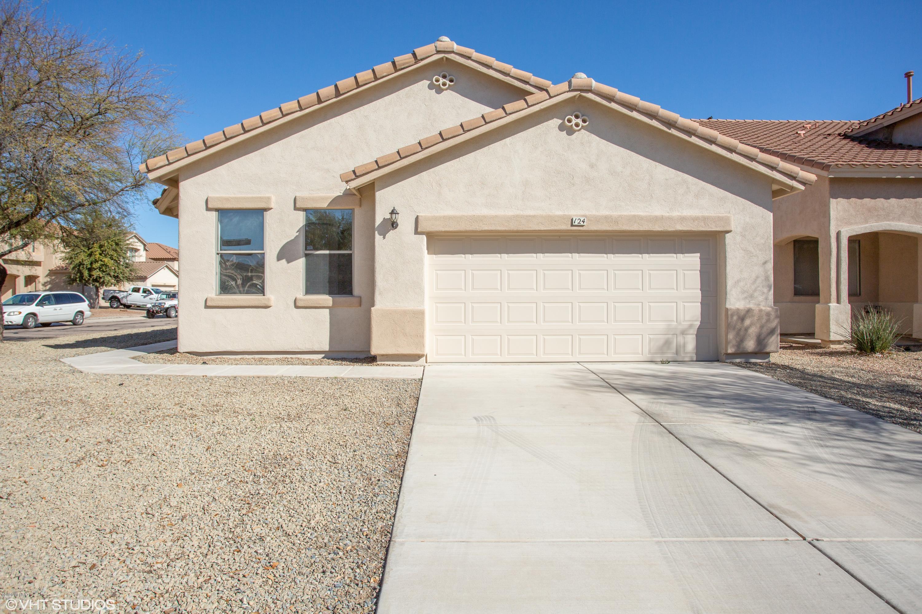 PRICE JUST REDUCED! This is a Fannie Mae HomePath property. With 1893 sq ft of living space this home has 4 bedrooms, 2 bathrooms, spacious kitchen with plenty of cabinet space, kitchen island & dining area. Family room with fireplace & backyard with covered patio great for entertaining. Laundry room & 2 car garage.<FONT COLOR=RED> Recently painted exterior & interior, installed NEW carpet, NEW stainless steel kitchen appliances, NEW granite counter tops, NEW ceiling fans & light fixtures.</FONT> Located in the popular community of Rancho Sahuarita with community pools and parks, near I-19, shopping and much more! Attention First Time Buyers: complete the HomePath Ready Buyer homeownership course. Attach certificate to offer and request up to 3% closing cost assistance. Ask Agent for more details. Restrictions apply.