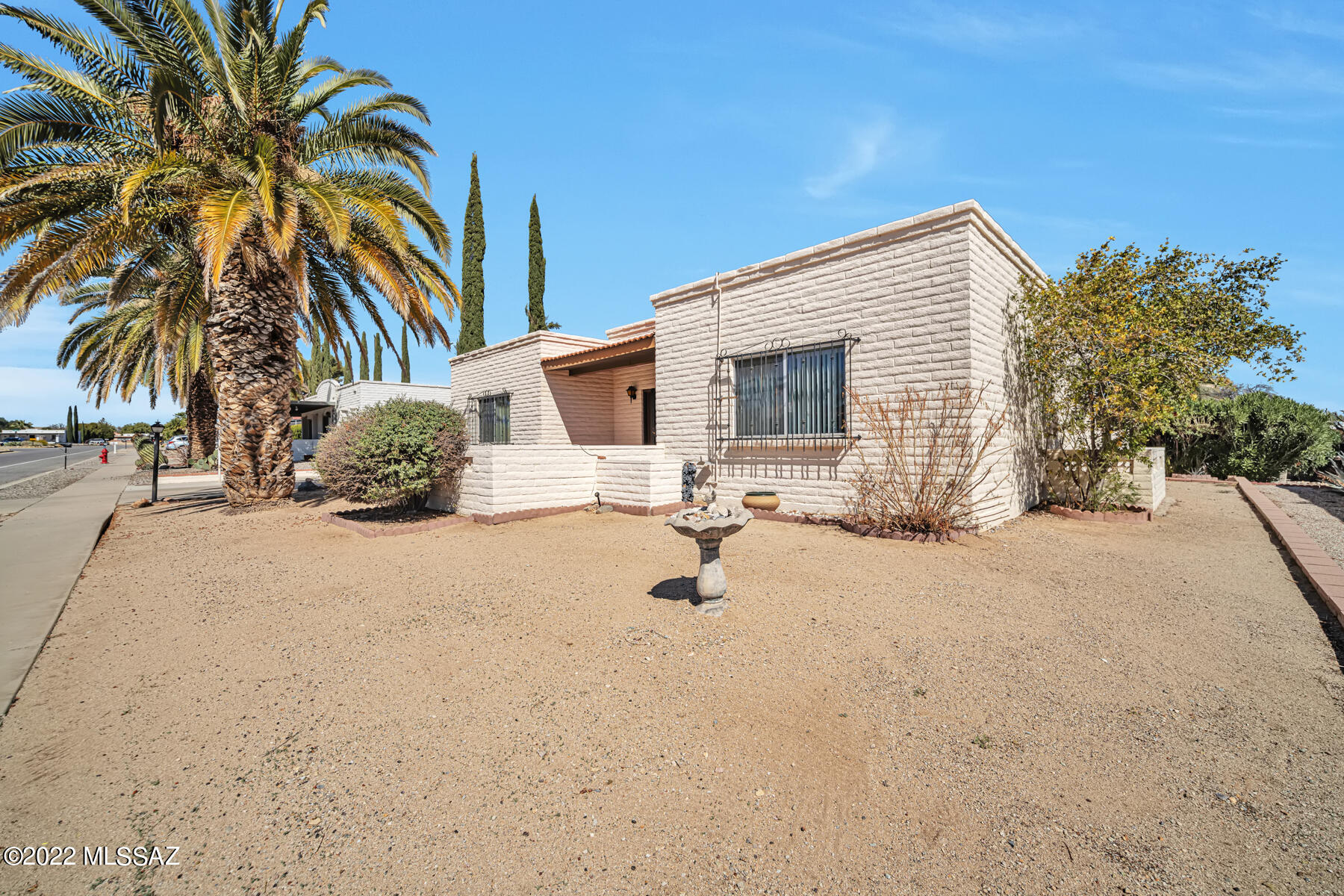 Updated 2 bedroom/2bath home in highly desireable Desert Meadows.  Within  walking distance to Desert Meadows Park and the heart of beautiful Green Valley.  Home is tiled throughout.   Tastefully updated kitchen boasts beautiful pecan cabinets and granite counter tops and all  appliances stay with home. The  spacious laundry/workshop is off of a bright and cheerful Arizona room that leads out to the private back yard that also has an additional workshop/storage room. Driveway has  extended poured concrete for extra parking..  New HVAC in 2021.  This desert jewel is immaculate and ready for you to move in and call home.