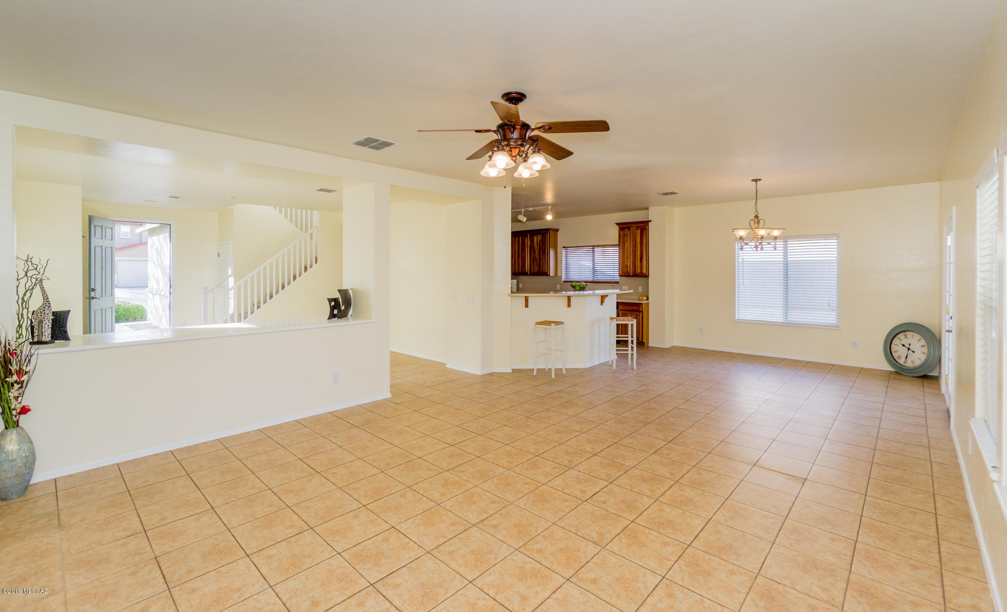 Fantastic 3BD / 2.5BA + Loft / 3 CAR GARAGE home in the heart of Santo Tomas Villas neighborhood.  Enter this 2250 sqft two story home into a living room that opens to a spacious family/dining room with breakfast bar. Kitchen with upgraded cabinets, Corian counters, SS appliances, NEW MICROWAVE and pantry closet. Main floor with ceramic tile flooring and convenient powder room. FRESH INTERIOR PAINT and NEW CARPET. The Upstairs boasts 3 comfortably sized bedrooms, including the Master Suite with partial MTN views, large walk-in closet and dual sink vanity. You'll also find a huge loft area that can be used for a play room, media room, studio or office space and the laundry is conveniently located on this floor. Enjoy your afternoons at the backyard with extended porch. LOW HOA . LOW HOA only $20/month. Great location close to shopping and easy access to 1-19.