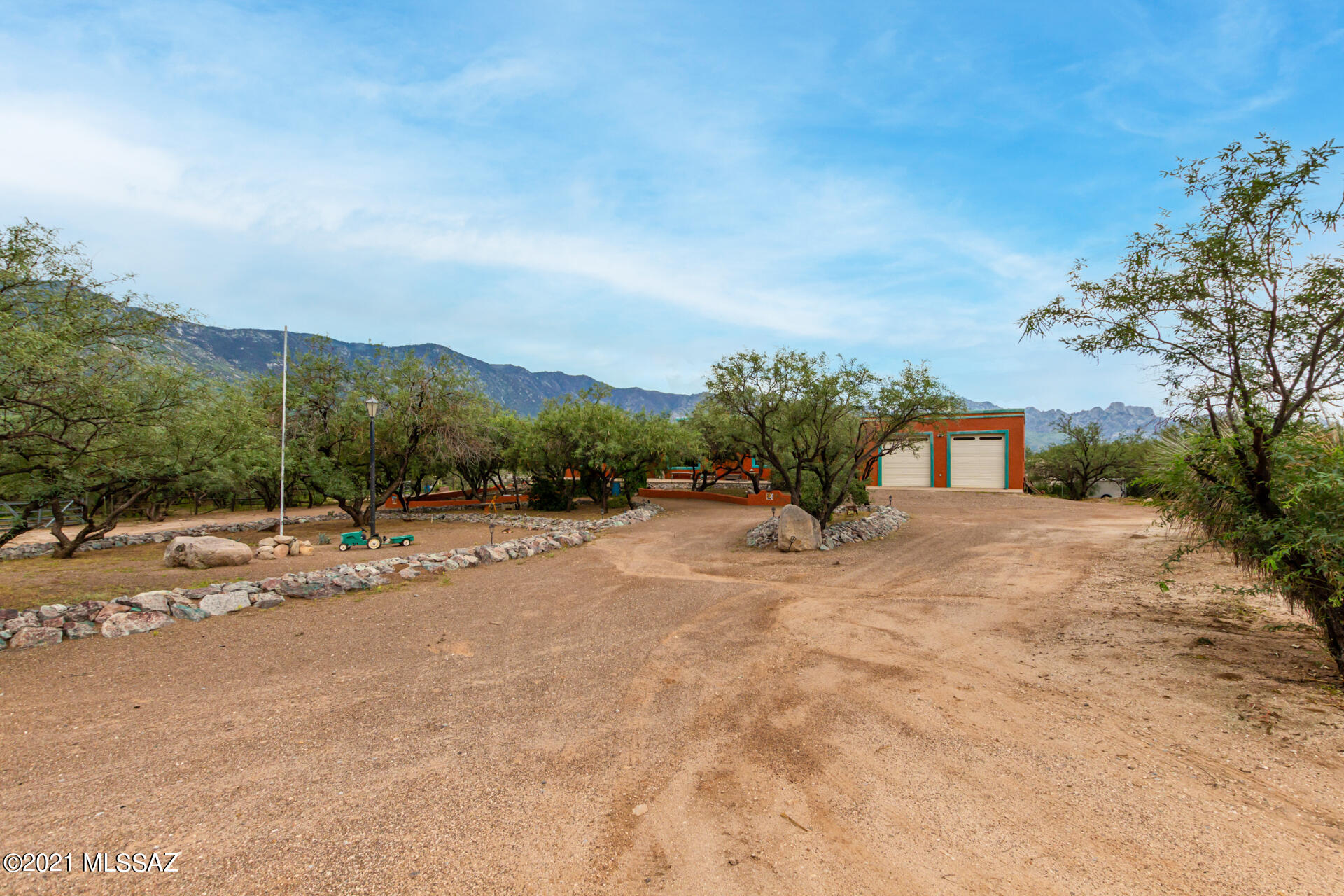 These are panoramic Catalina views with unlimited horseback riding trails. There are hiking and biking trails to Coronado National Forest! It is a beautiful Next Generation home that has a 4 bedroom 3 bath main house.  There is a separate living quarters with a full kitchen and bathroom.  This property has an RV garage with a full bathroom. This area allows for horses and multiple animals to live in harmony. It sits on 2 acres that are truly a must see!  This house now has new paint inside and out as well as a new rolled roof.  This oasis offers so much so come check out where a champion lived!