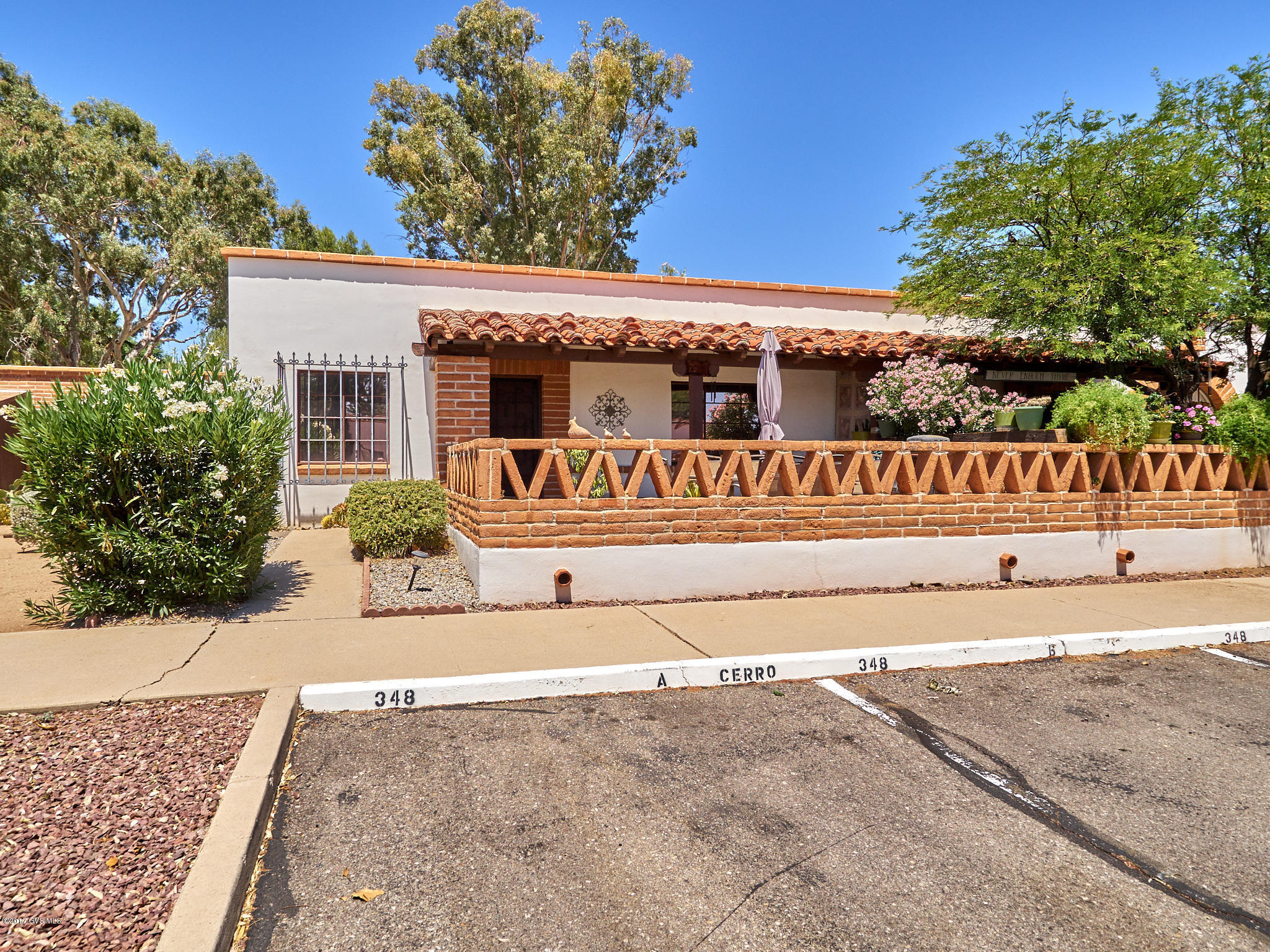 This is your winter retreat or full time home, close to shopping, banks, library, churches, ect. Fully furnished, just bring your toothbrush, this is a delight, your parking space is right in front of the unit, plus extra parking for family and friends. From your patio enjoy the beautiful Santa Rita Mountain view... and a very green park area. This unit has green Valley Recreation attached to it for access to it's over 60 clubs, activities and entertainment year round. The HOA covers the exterior of property, to include hot water heater, roofing, outside painting, pest control, water, garbage, AC/Heater unit, plus all landscaping of the common areas. Don't pass this one up, it has additional screened room off the kitchen with washer/dryer.