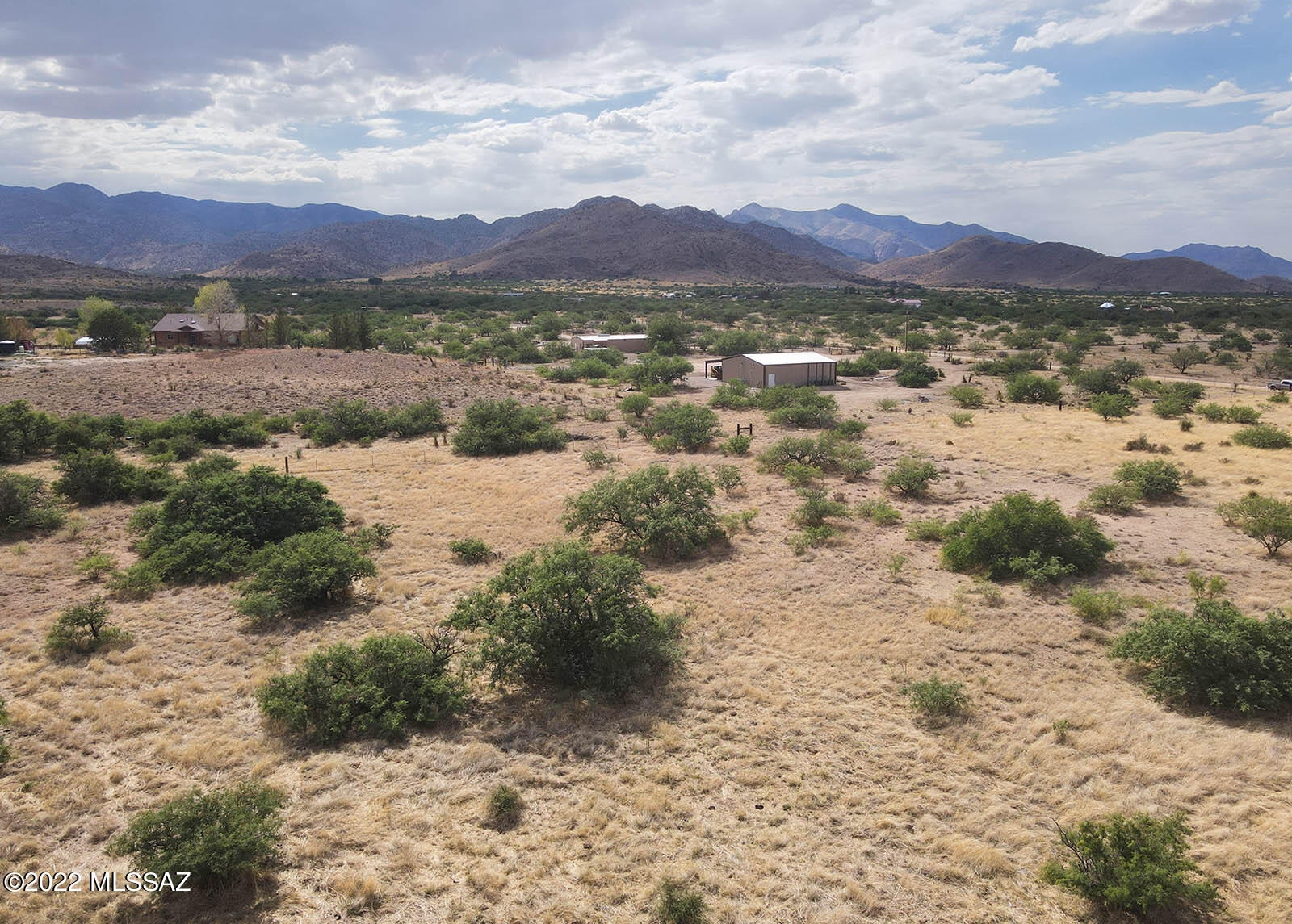 This 5 acre parcel is an exceptional offering; located in Sun Site Ranches near the southwestern corner of Sun Sites on the Eastern slope of the Dragoon Mountains. Featuring spectacular panoramic mountain views. Desirable RU-4 zoning and power to the lot. Immediate access to both county-maintained Desert & Pearce Roads. Just a half mile to the Coronado National Forest line. Gorgeous & green in summer monsoon season. This piece offers great topography for building and is situated in an increasingly-desirable area. Abundant wildlife and exceptional natural beauty abound on this special parcel. Bring your horses or toys and enjoy the cool open air while you develop your Southern Arizona country dream project.