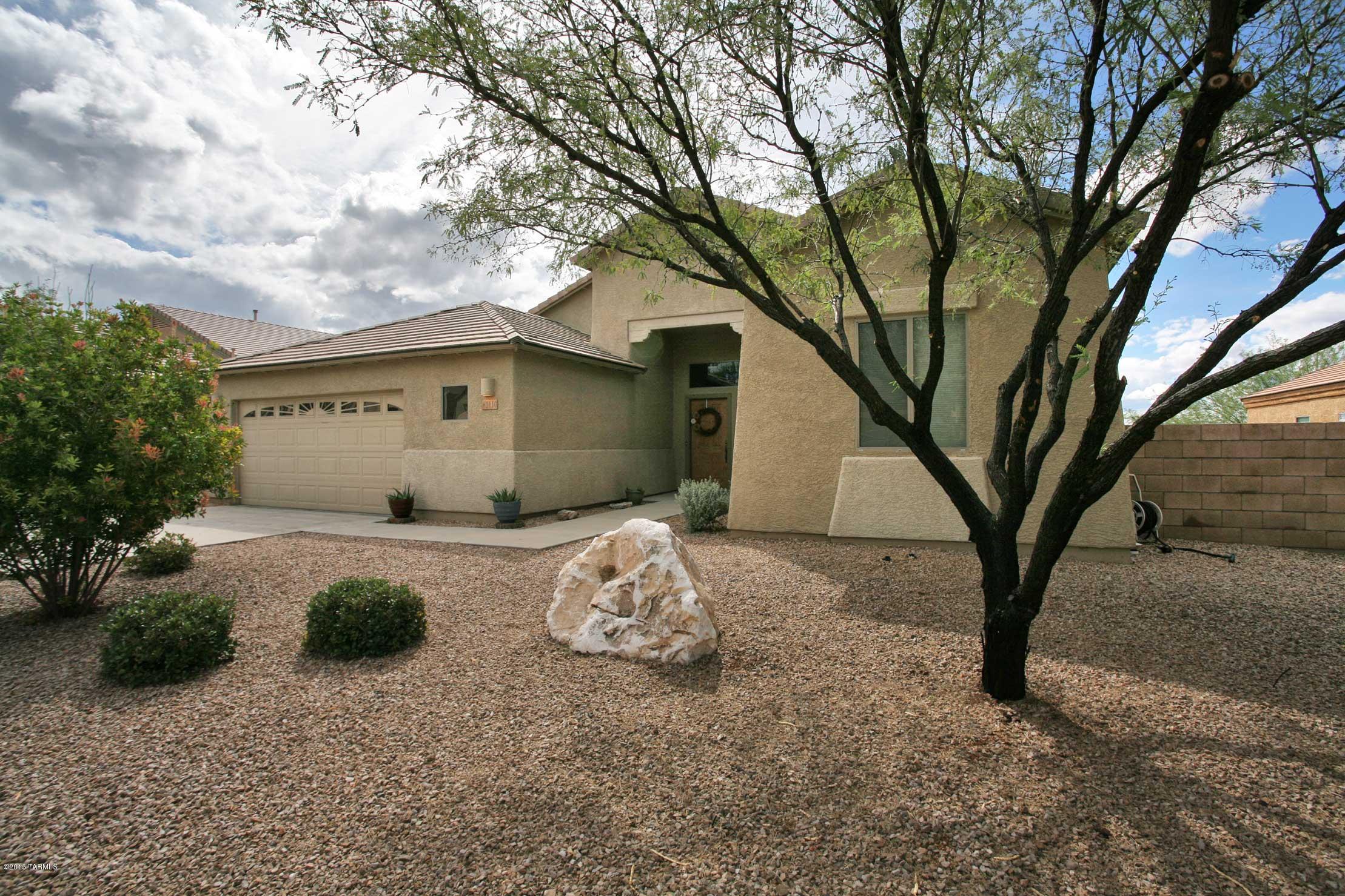 Range priced - seller will accept/counter offers w/in the range 214900-229900.  Beautiful open and bright floor plan with modern upgrades throughout. New dark tile flooring that looks like wood throughout the main home. Kitchen is beautifully upgraded with granite counter tops and cabinetry. A beautiful mix of modern and rustic southwest that looks like a model home. The master bedroom is spacious with windows overlooking the mountains. The master bath boasts a garden soaking tub, a separate shower and dual sinks. The backyard has endless views of the mountains. The backyard is your oasis with a view fence to enjoy watching the Tucson sunsets and panoramic mountain views. This homes is a must see!