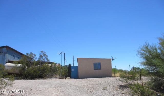 Parcel information is identified as 17181 E Zoo Stage Rd.  This is a nice location out in the country.  There are two houses on this parcel.  The first is 17179 E Zoo Stage, this is a one bedroom / one bathroom house, 510 sq.ft. with a separate structure that could be used a studio.  The next is 17181, this is a 2 bedroom / 2 bathroom house, 1081 sq. ft.  With a separate structure that could be used as a studio.  There is also a large warehouse available.  This is an adventure, here is a chance to let your imagination run wild.  According to local electric company, the property has never had service.  The property also has no water source.