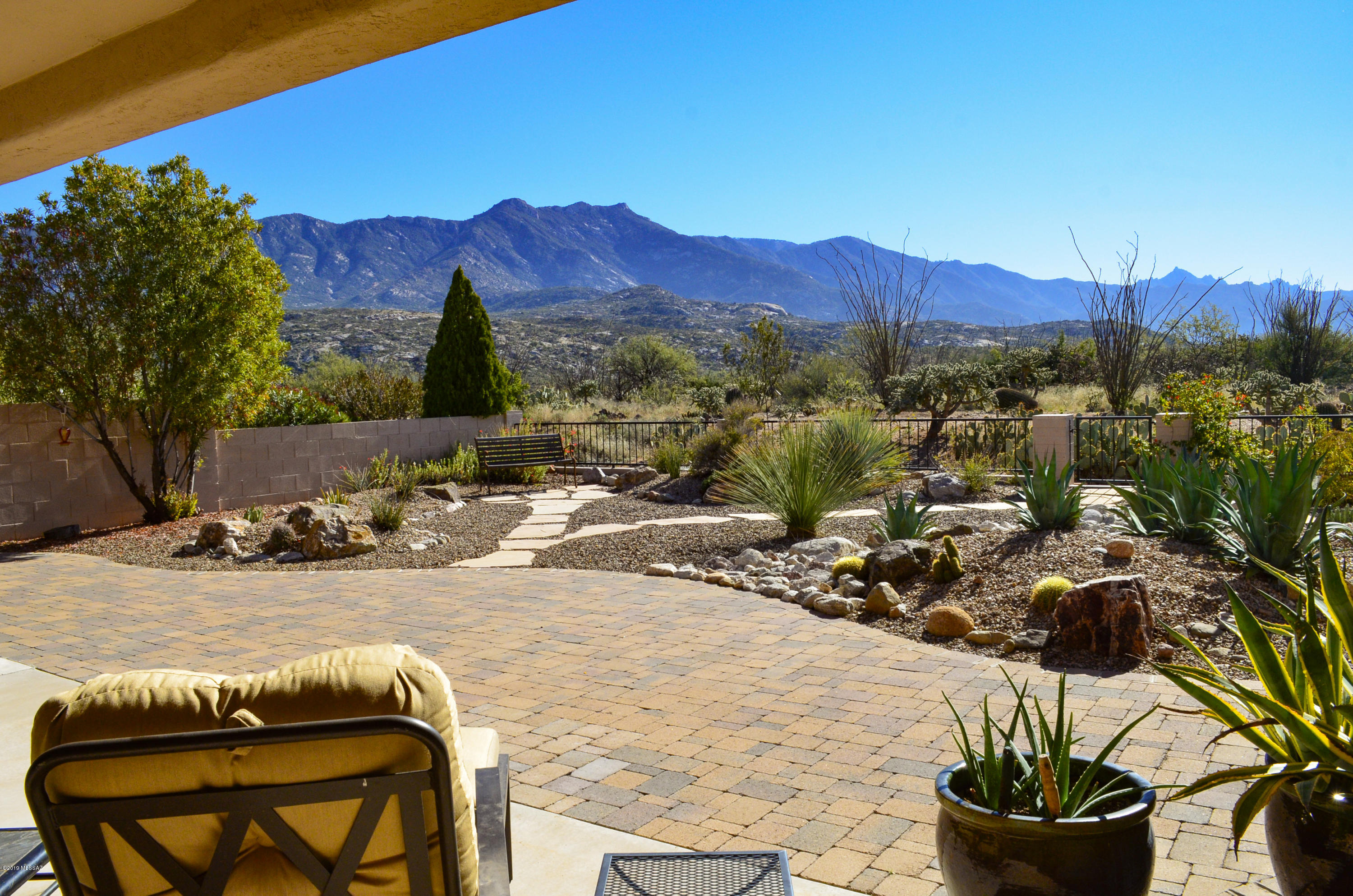 Stunning Catalina Mountain Views from Inside & Out of this Wonderful Madera Model in Saddlebrooke. Extremely Private Setting Backing to Pristine Desert. The Open Great Room Design, Vaulted Ceilings & Plentiful Windows Create a Light & Airy Ambiance. Updated Kitchen with Slab Granite Counters, Stainless Appliances, 5-Burner Gas Range & Under Cabinet Lighting. Sunny Dining Area & Private Breakfast Nook. Master Suite with Mountain Views & Walk-in Closet. Elegant Master Bath with Granite Counters, Cherry Cabinets & Custom Tiled Shower. Comfortable Guest Room & Full Guest Bath. Den, Laundry & Powder Room. Resort Quality Outdoor Living Space Featuring a Covered Porch, Extended Paver Patio, Meticulous Landscaping & Catalina Mountain Views. Extended Garage with Golf Cart Parking Bay. Move-in Ready
