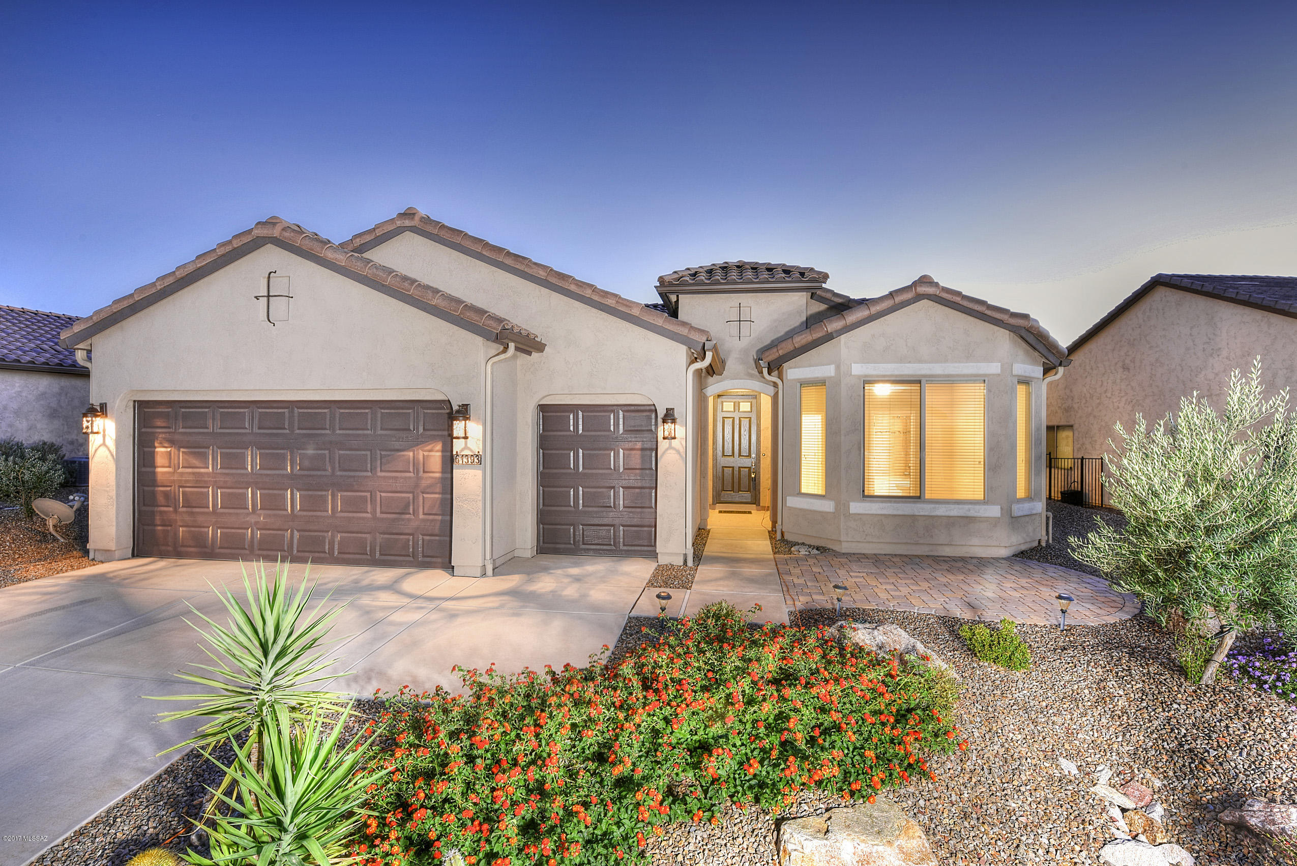 Welcome Home to the newest Robson Community in NW Tucson! Guard gated w/many amenities including golf, spacious indoor & outdoor pools, pickleball, tennis, fitness center, day spa, art & hobby classes & various activities for all lifestyles! Glorious sunrises & sunsets reflecting on the Catalina Mountains from your upgraded designer Dolce home. Entertain guests in the open concept great room featuring 18” Porcelain tile, cocoa finished hardwood cabinetry, soft-close drawers, Quartz counter tops, tumbled stone tile backsplash, SS Appliances & beautiful bay windows. Immerse yourself in the stillness & beauty of the professionally landscaped backyard showcasing native flora & an extended patio w/built-in sun screens for added privacy. Vacation living year round! Unwind in the spacious Master Suite with gorgeous Quartz counter tops, dual vanity, custom tile shower, & walk-in closet. Invite family & friends to stay in the guest suite with attached bath and closet. Come see the beauty of this home today!