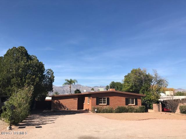Beautiful mid-century red brick home  located in established central neighborhood. Property has ceramic tile floors, carpet in guest bedrooms,  cozy fireplace in family room, and split bedrooom floorplan. Great for entertaining with private fenced in pool with mountain views. Plus extra storage in backyard. Owner is resurfacing pool and having cool deck redone. Alarm service included! Rent will be $1900 for the first 3 months due to non use of pool.  After 3 months rent will be $2000. Please ask for clarification if needed!