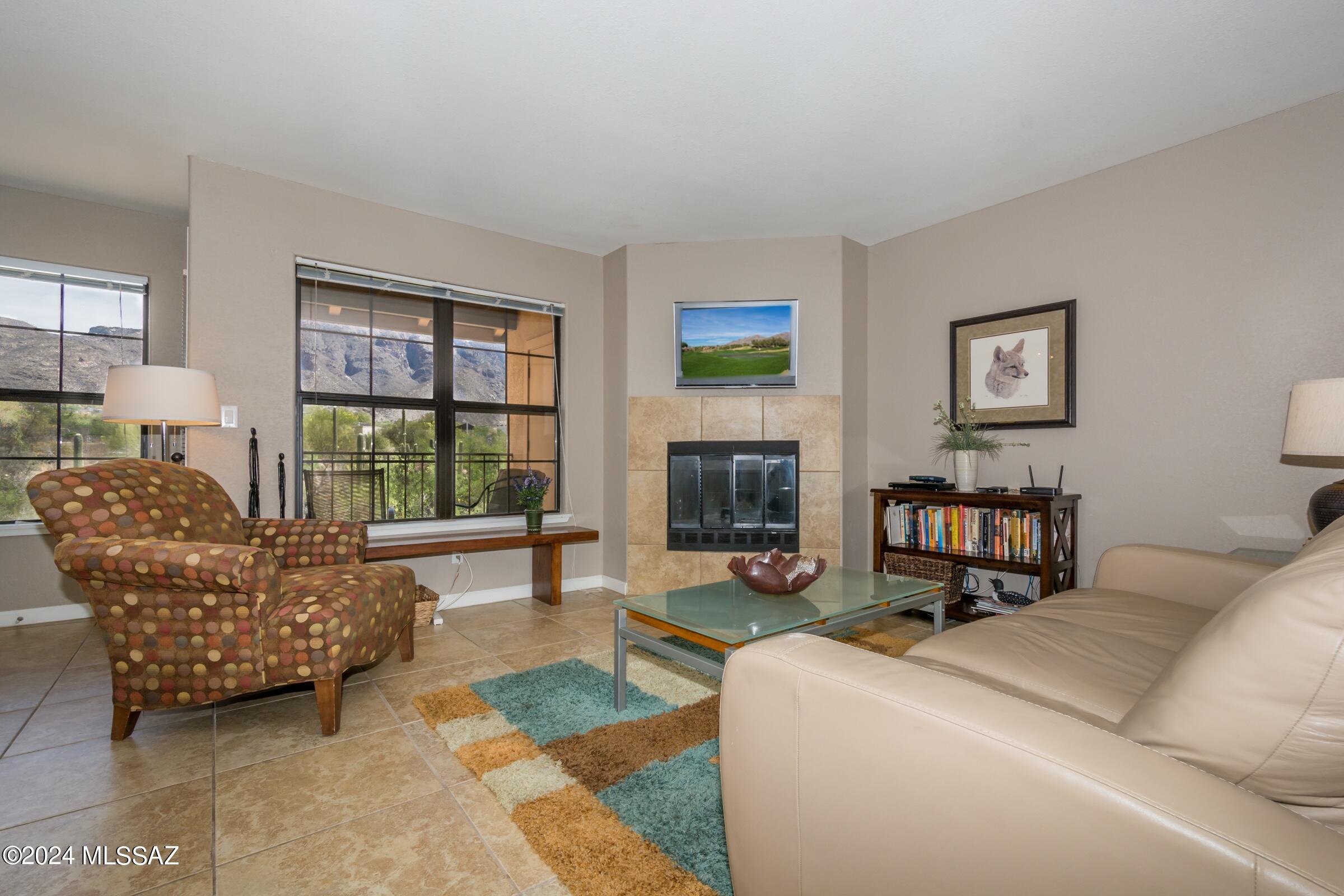 Sometimes the best things come in small packages thus this perfect one bedroom condo overlooking a little riparian area & sweeping view of the Catalina Mountain range. Close to La Encantada where you can enjoy coffee at AJ's or dinner at one of the many restaurants. Pool, spa & workout room & only a half mile to a trailhead heading into the Catalinas. It's a lifestyle! Professionally cleaned & read to move into Covered parking #58. Each condo has a water meter & is billed along w/HOA monthly fee. Furnishings may be purchased except for three pieces of art. SELLER IS LICENSED REALTOR IN THE STATE OF ARIZONA. TITLE WORK HAS BEEN STARTED. PLEASE ESCROW WITH LORI BALSINO, FIRST AMERICAN TITLE.