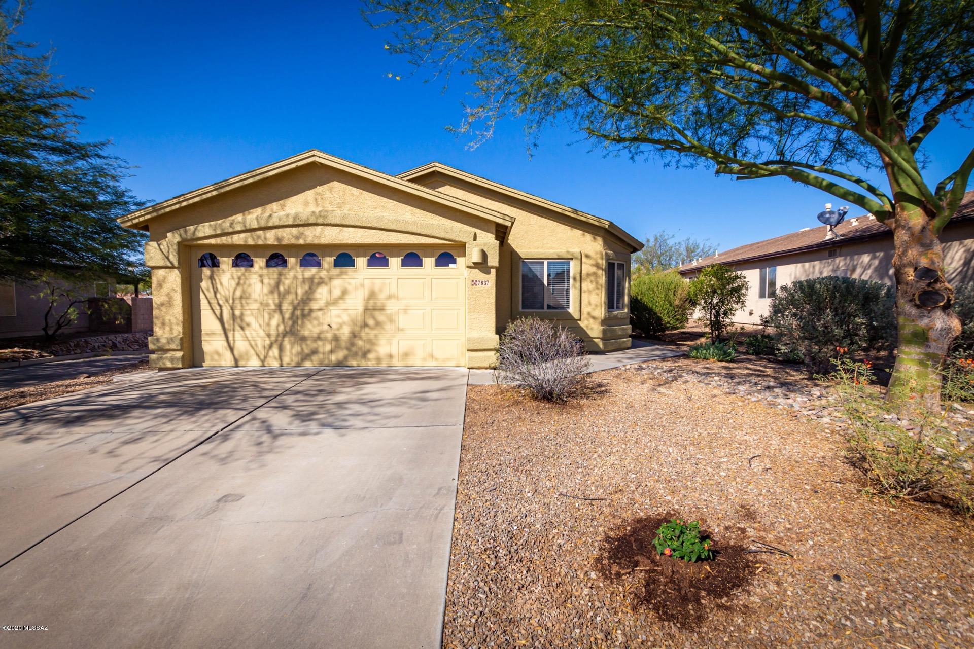 Fantastic Rita Ranch opportunity in one of its most functional and popular floor plans! 3 bed with additional room that can be used as office, den, or fourth bedroom (closet & window included- just add doors!) Vaulted ceilings, plush carpet, French doors to patio, & welcoming palette. Freshly painted interior and exterior. Saltillo tile, SS appliances, plenty of wood cabinets, & dining area w/ upgraded lighting. French doors to patio from great room.  Easy home to make your own! Master retreat boasts a walk-in closet & private en suite w/dual sinks. Ample closets, 2 pristine baths, large closets, & interior laundry room w/ storage cabinets.  Large paver patio w/ lush green grass, raised flower beds, and no neighbors directly behind. Borders greenbelt. Take a tour today!