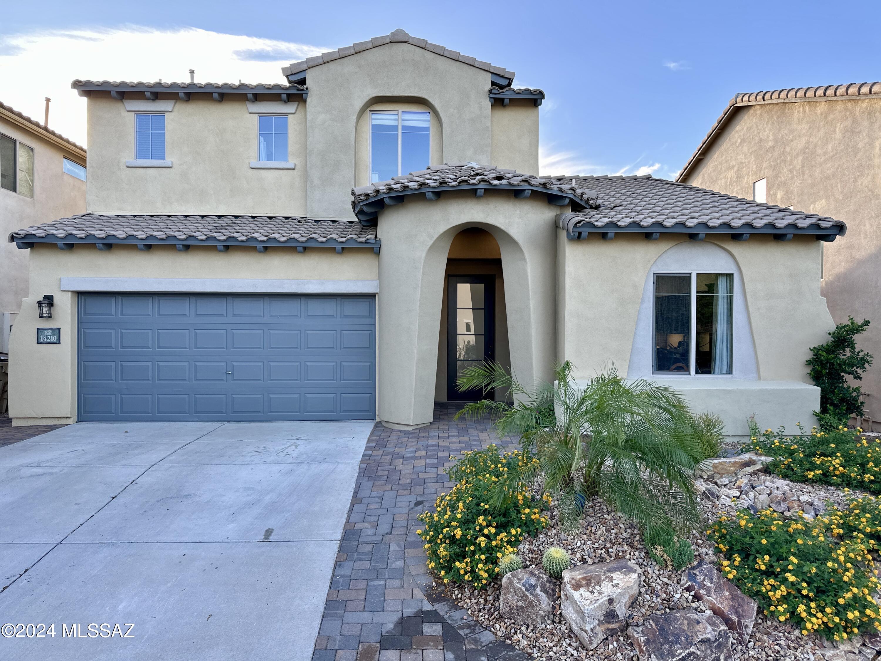 Welcome to master planned Rancho Sahuarita. This beautiful 2-story Pulte home has 3 bed & 3 full baths. 1 bedroom & updated bathroom is downstairs. Features new exterior paint, modern front door, energy efficient lighting, vinyl plank flooring & newer A/C. Supreme out door areas w/all new front & backyard landscaping, amazing concrete & excavation work, newly paved walkways both sides of home, driveway, around fire pit & new turf. Move-in ready w/ no rear neighbors, backing to Wilderness trail. Community amenities provide something for everybody. You will enjoy the Waterpark, clubhouse, Tennis, Pickleball, Bball, Vball, Putting, exercise facilities, Lake & on & on.. This is living!