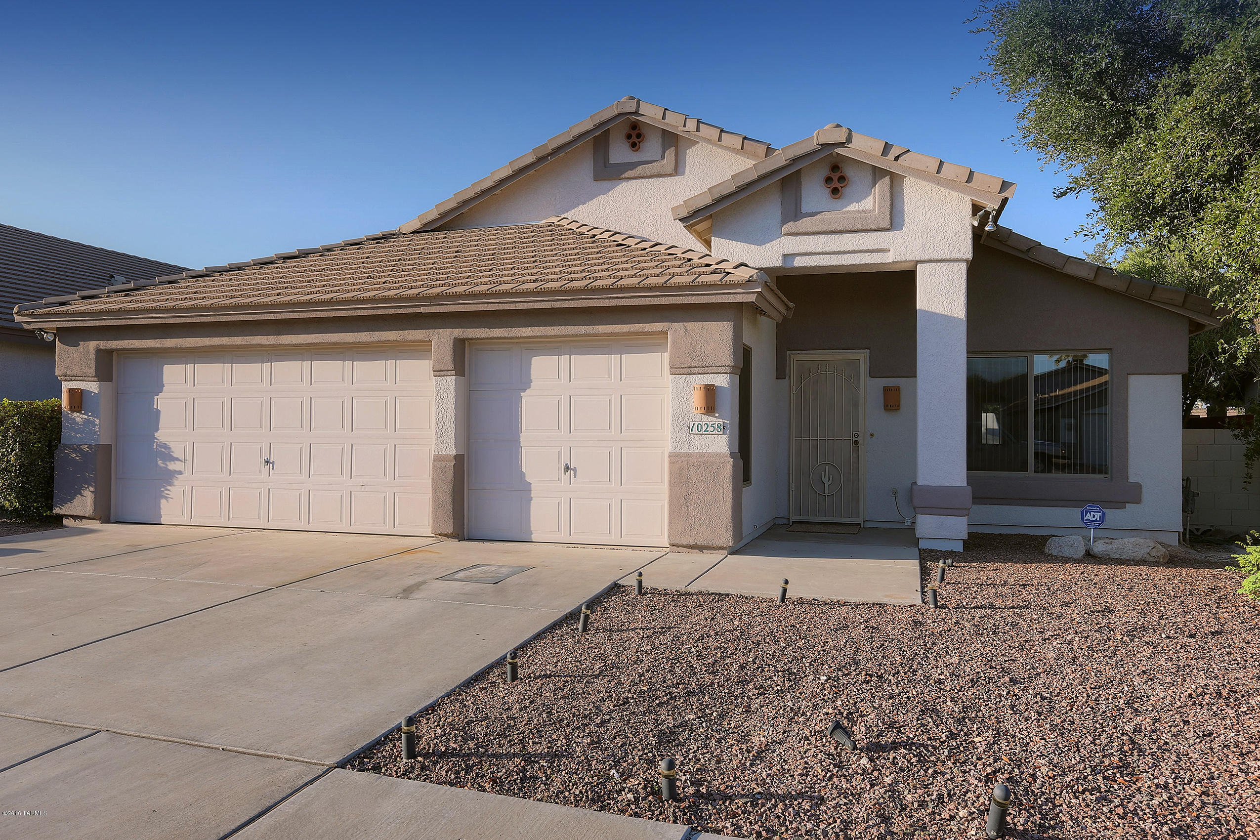 BEAUTIFUL FORMER MODEL!  This home is fresh, clean and move in ready!  Neutral tones w/decorator touches, high vaulted ceilings, upgraded tile and ceiling fans and wide open floor plan great for entertaining. Cozy fireplace with built in entertainment center and Huge double door entry master bedroom with garden tub, double vanities, & separate shower. Surround sound in family room & master bedroom. Lovely patio w/built-in beehive fireplace. 10x10 tuff shed. Built-in cabinets in 3-car garage. Satellite dish. This home shouts perfection! Three car garage with windows (former model office) close to middle school. 10 minutes to Davis Monathan and an easy commute to downtown and U of A.
