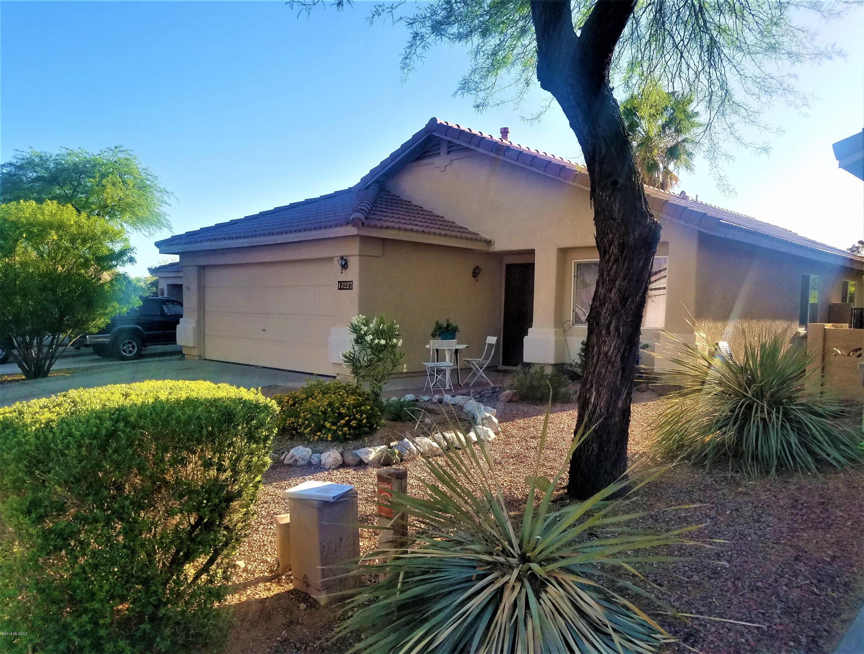 Gorgeous 4 bed 2 bath home, with separate living space and formal dining. Upgraded kitchen with granite counter tops and S.S. appliances. Beautiful wood tile throughout the entire home, with new carpet in all bedrooms. Master bath has been completely redone with dual sinks, chic, stylish tile in walk in shower, topped off with warm colors to create a relaxing master suite. Hall bath has been updated with new granite sink and elegant fixtures. Ac unit just two years old. Large, low landscape backyard with lemon and orange trees, plenty of room for those nights of family entertainment. Move in Ready! Lots of room in this lovely home. This home shows great, and wont last!