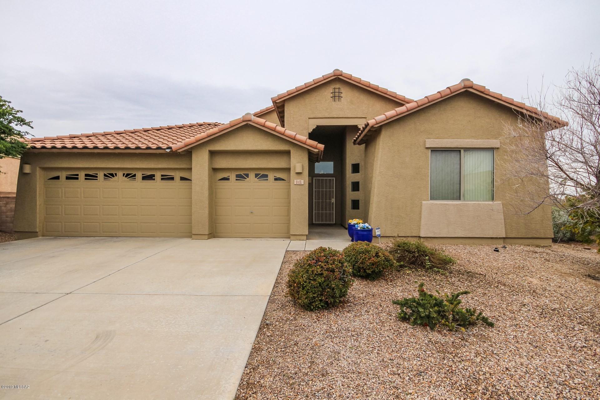 This Is What You've Been Searching For! Masterful design & luxury in this 4 bedroom 2 bath home with 2,338 SF of living space. Mountain and sunset views. Borders natural and common areas. Open floor plan concept and softly filtered light throughout. The island kitchen features a breakfast bar, SS appliances, warm wood cabinetry, pantry, plant shelving and soothing grey countertops. The spacious bedrooms offer plenty of room for sleep, study and storage. The master bathroom features a garden style bathtub, dual sinks and a separate shower. The expansive backyard showcases a covered patio, no-care grass and tons of space that offers endless possibilities. Swing set conveys. Look no further! Book your showing today! This home will not disappoint