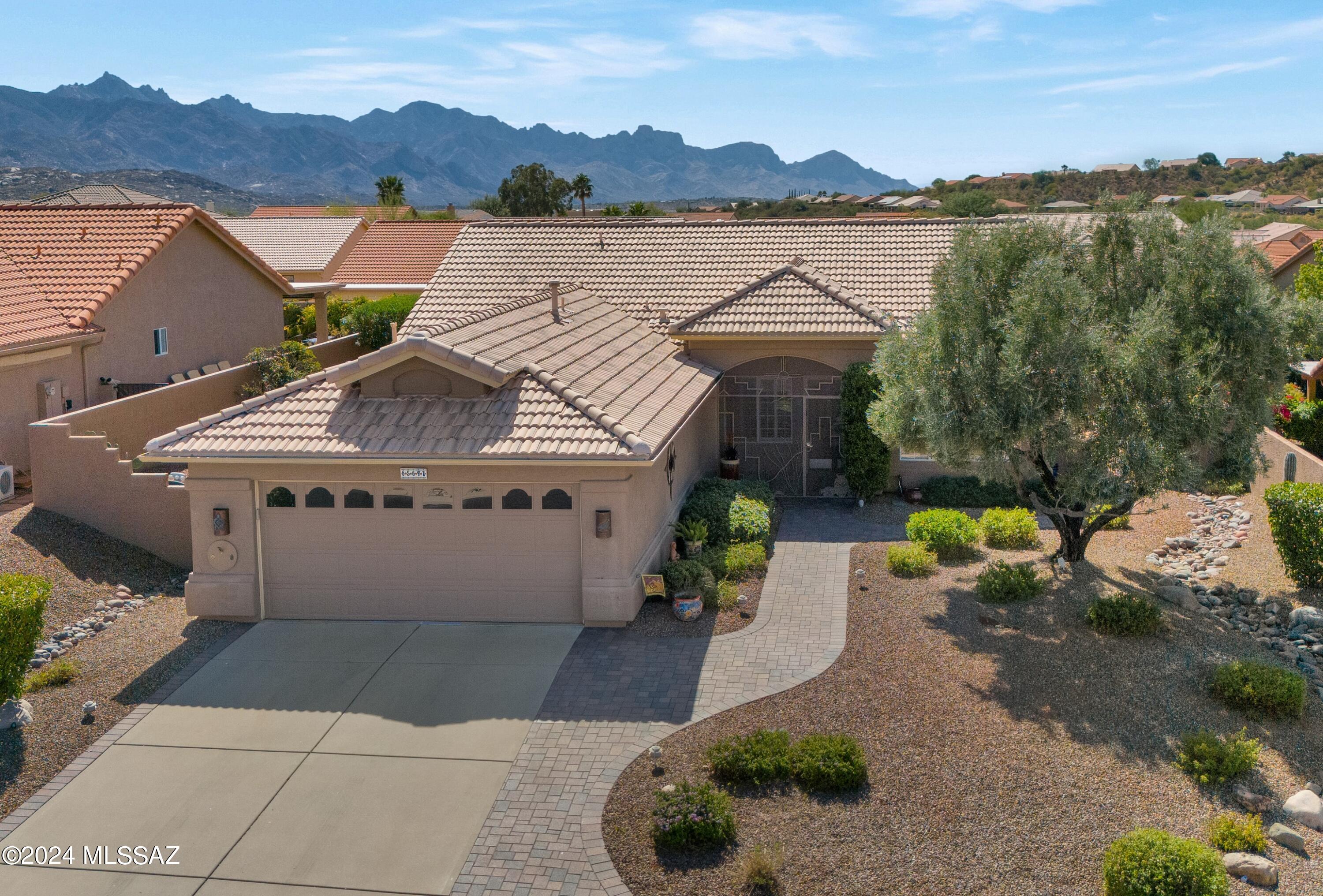 Expanded Diego with Double Owner's Suites & Mountain Views. Great Curb Appeal! Spacious Living Room & Dining Area upon entering. Family Room open Kitchen & Slider to Patio. Kitchen offers Quartz Counters, Stainless Steel Appliances,  White Cabinets with Pull-Outs & Breakfast Nook with Bay Window. Handy Powder Room for Guests. Owner's Suite with Slider to Patio. Updated Owner's Bathroom with Custom Walk-in Shower & 2 Closets. 2nd Owner's Suite offers EnSuite Bathroom with Closet & Shower. Expanded Laundry Room with W/D, Desk & Cabinets. Plantation Shutters thru-out. Extended 2 Car Garage with 2022 HVAC, Utility Sink & Cabinets. Beautiful Paver Covered Patio with extended Pavers, Water Feature, 3 Rolling Shades, Rose Bushes, Gated Yard & Lovely Landscaping with Mountain Views! Welcome Home!