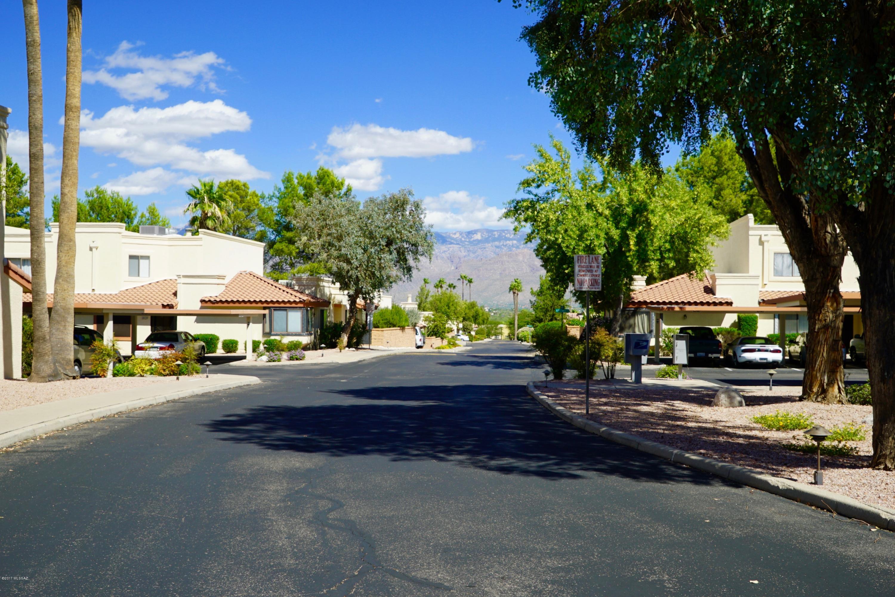 Back on Market!! RARE FIND in THE NORTHEAST. 2 CAR CARPORT, 3 BEDROOM 3 BATH CONDO W/ NORTH/SOUTH EXPOSURE. BALCONY OFF MASTER HAS CATALINA MOUNTAIN VIEWS! SURROUND SOUND SPEAKERS LIVING ROOM & MASTER. SECOND BEDROOM W/ FULL BATH & SMALL FRIDGE UPSTAIRS. CEILING FANS IN ALL ROOMS. DOWNSTAIRS FULL BEDROOM W/ DOUBLE DOORS & FULL BATH. LAUNDRY CLOSET DOWNSTAIRS HAS AUTOMATIC LIGHTS. ALL APPLIANCES INCLUDED IN SALE. FIREPLACE IN LIVING ROOM. BRAND NEW WATER HEATER INSTALLED 12/17. SUN-SETTER AWNING CONTROLLED BY REMOTE SHADES MOST OF THE PATIO CREATING AN EXTRAVAGANT OUTDOOR SPACE. SECURITY BARS ALLOW ONE TO LET THE BREEZE IN. HOA OFFERS HUGE COMMUNITY POOL, SPA, WADING POOL, PLAYGROUND, BASKETBALL COURT, PERGOLAS, & COMMUNITY CENTER! ALL CONTENTS & FURNITURE AVAILABLE. SBOS FOR $2K ONLY. FUN FOR ALL AGES! CONVENIENT LOCATION NEAR TRANSPORTATION & SHOPPING! HOME WARRANTY OFFERED WITH FULL PRICE OFFER FROM 2-10 HOME WARRANTY. ALL FURNITURE INCLUDED IN SALE AT HIGHER END OF RANGE.