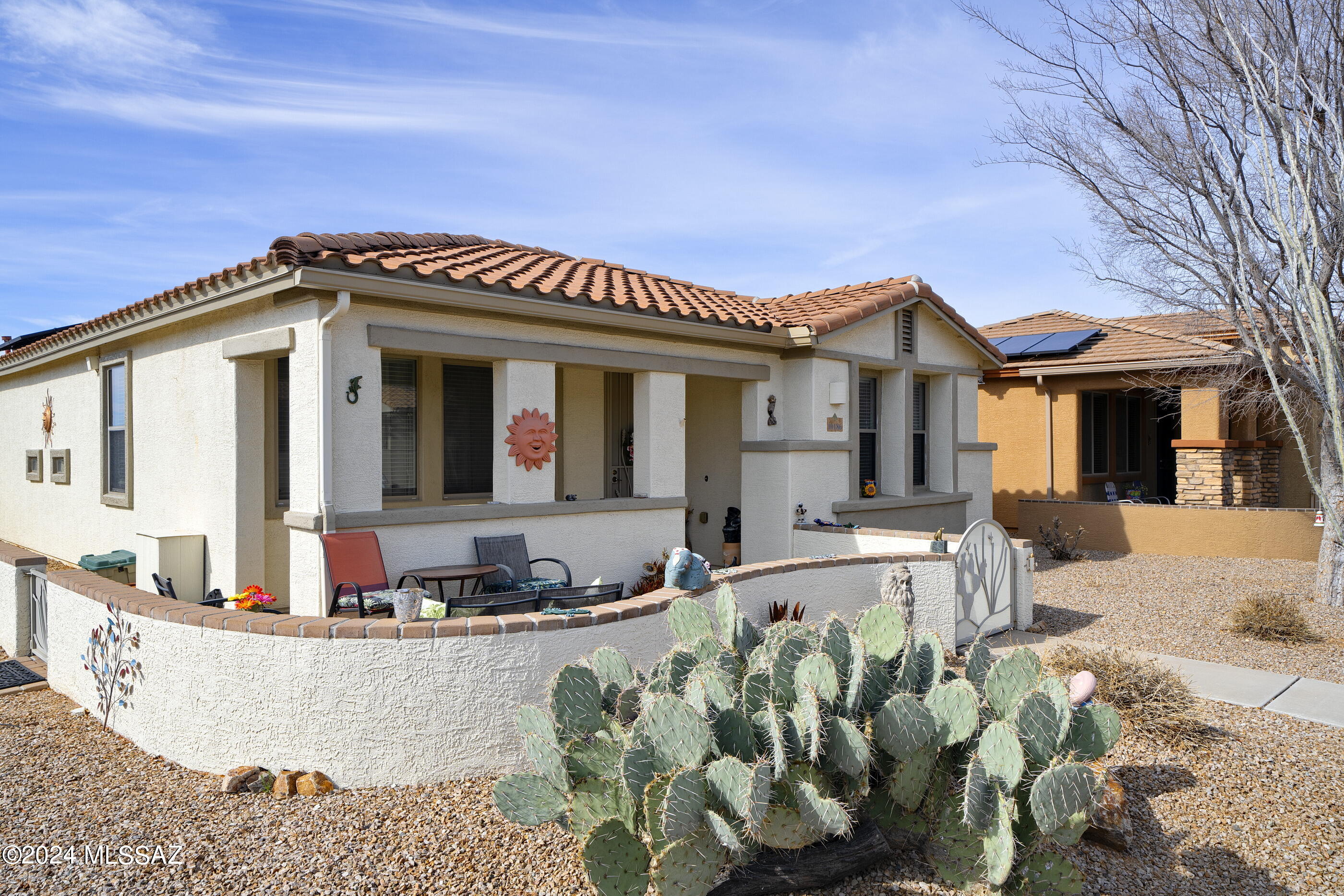 Seller to accept or counter offers bn $325K and $330k.   Assumable 2.5% VA loan - Any Buyer! Beautiful 2 bedroom w den on a corner lot in 55+ Active Adult community Del Webb at Rancho Del Lago. Cozy courtyard, perfect for hosting happy hour or morning coffee. Wide open floorplan has great light, wide open kitchen w island & extended countertop space perfect for hosting buffets, setting up your beverage center & small appliances. Kitchen island seats three stools comfortably. Tall sliding doors open to private patio. Primary bedroom has a large walk in closet, extra storage space & a walk in shower. OWNED SOLAR, Nuvo water filtration system, Existing home warranty to transfer to new buyer, Gutters,. Close to guest parking. Washer, Dryer, Fridge convey.