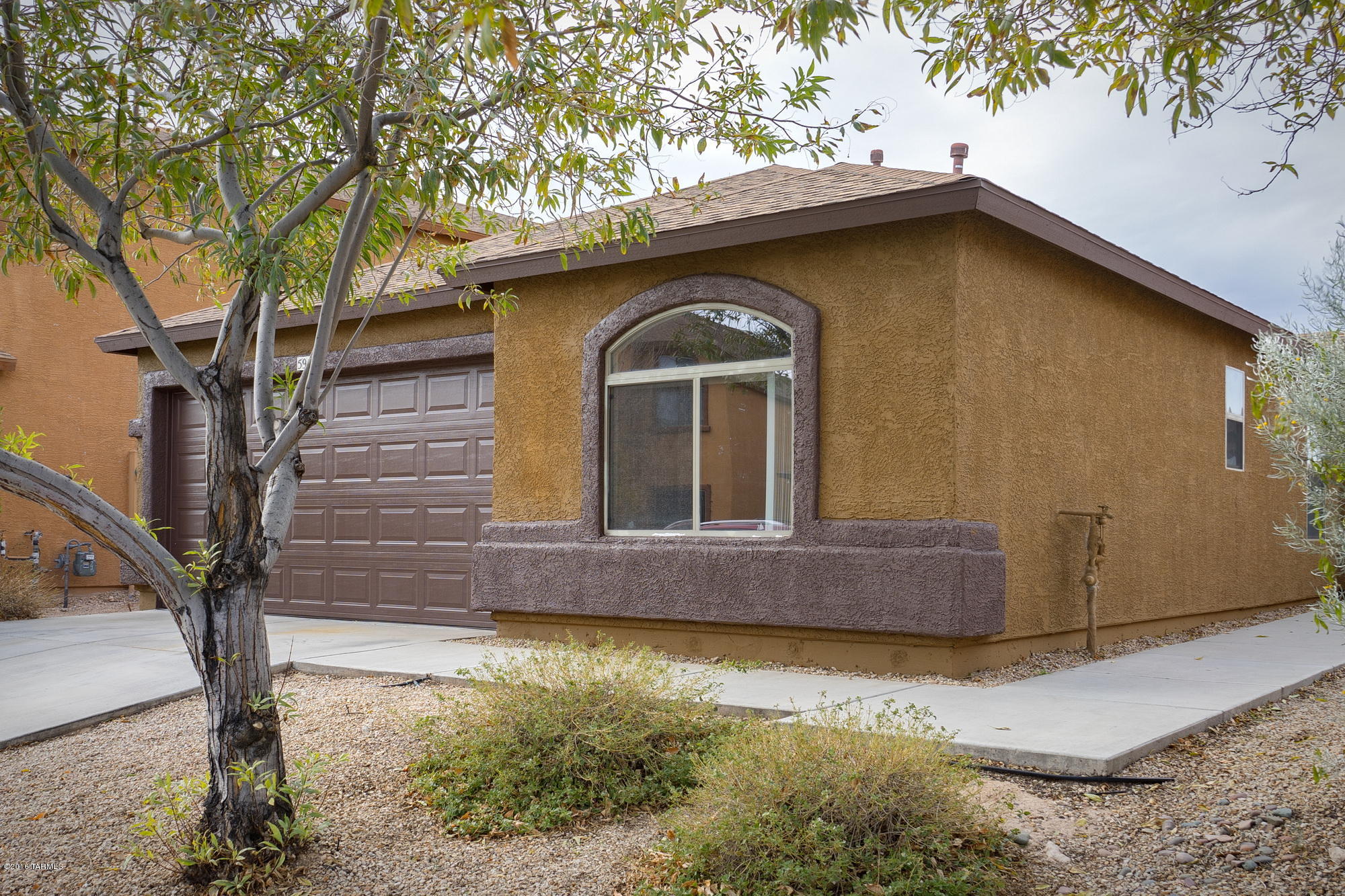 This 3 bedroom plus a den 2006 Dr Horton home in Tres Pueblos has space for everyone! Tile living areas. Kitchen with center island open to family and dining area. Split bedroom plan. 2 car garage. Great natural light. New exterior paint. Low HOA fee of $28/month! Tres Pueblos has a giant park with sports court, playground equipment, open grassy areas and picnic/BBQ areas. Great Community atmosphere! Please see 5951 S Placita Picacho El Diablo, same floorplan, also available for sale.