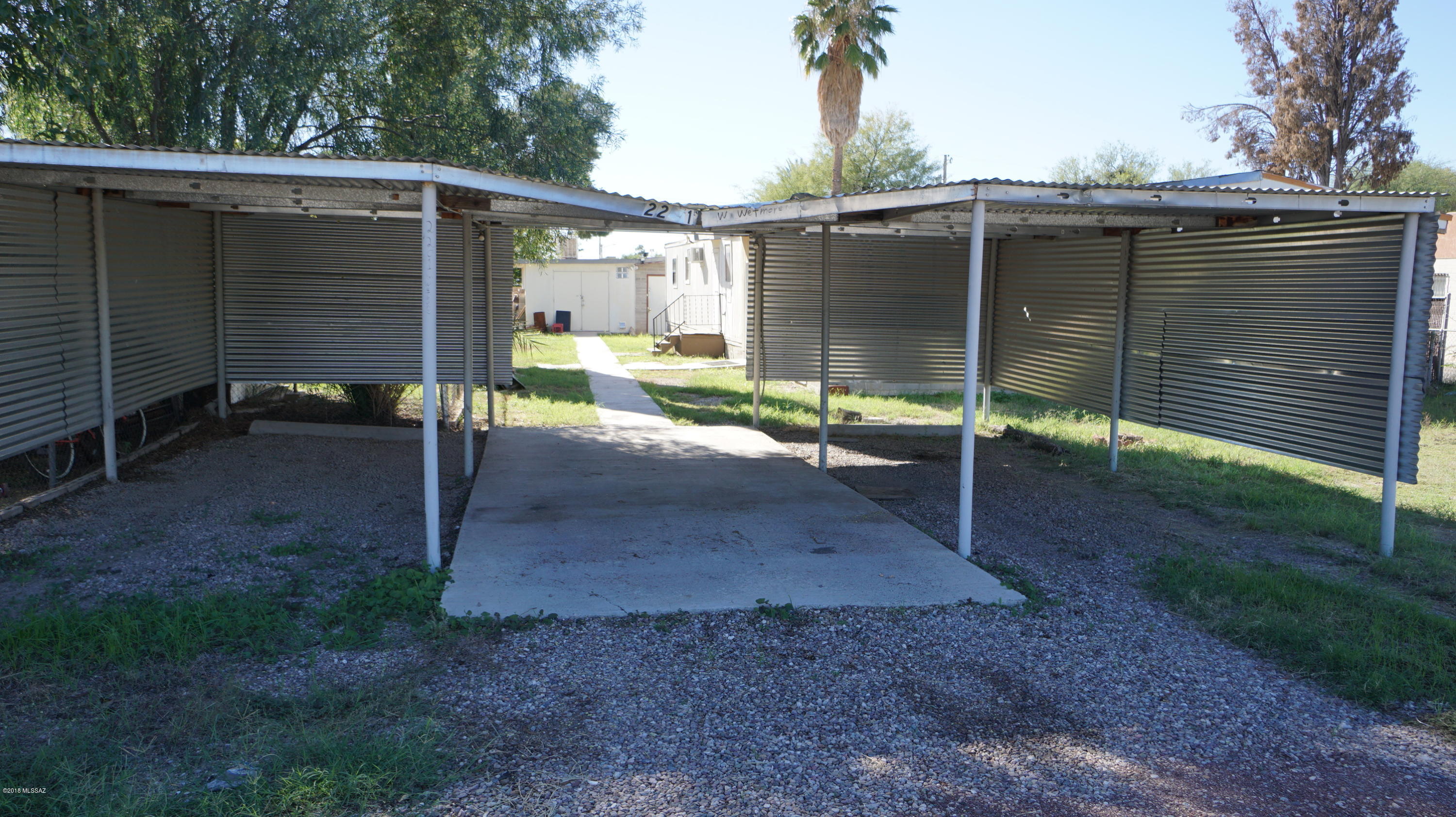 7 single wide & 1 double wide affixed mobile homes on a large lot,  good income producer (1 not livable as is) 8 certified septics on adjoining property. Convenient to I-10, schools, library. Terrific value! Listing agent will provide directions and additional information. No For Sale sign. Property is being sold As Is with adjoining lots (2201 W. Wetmore & 2129 W. Wetmore). No info available  on sq ft  for some  trailers, some affidavit of affixtures, info shown is a guestimate,  buyer to verify. Est rent: $2,400/mo; water: $200/mo (owner pays). Contact agent, Vikas for more info-520-204-2008.