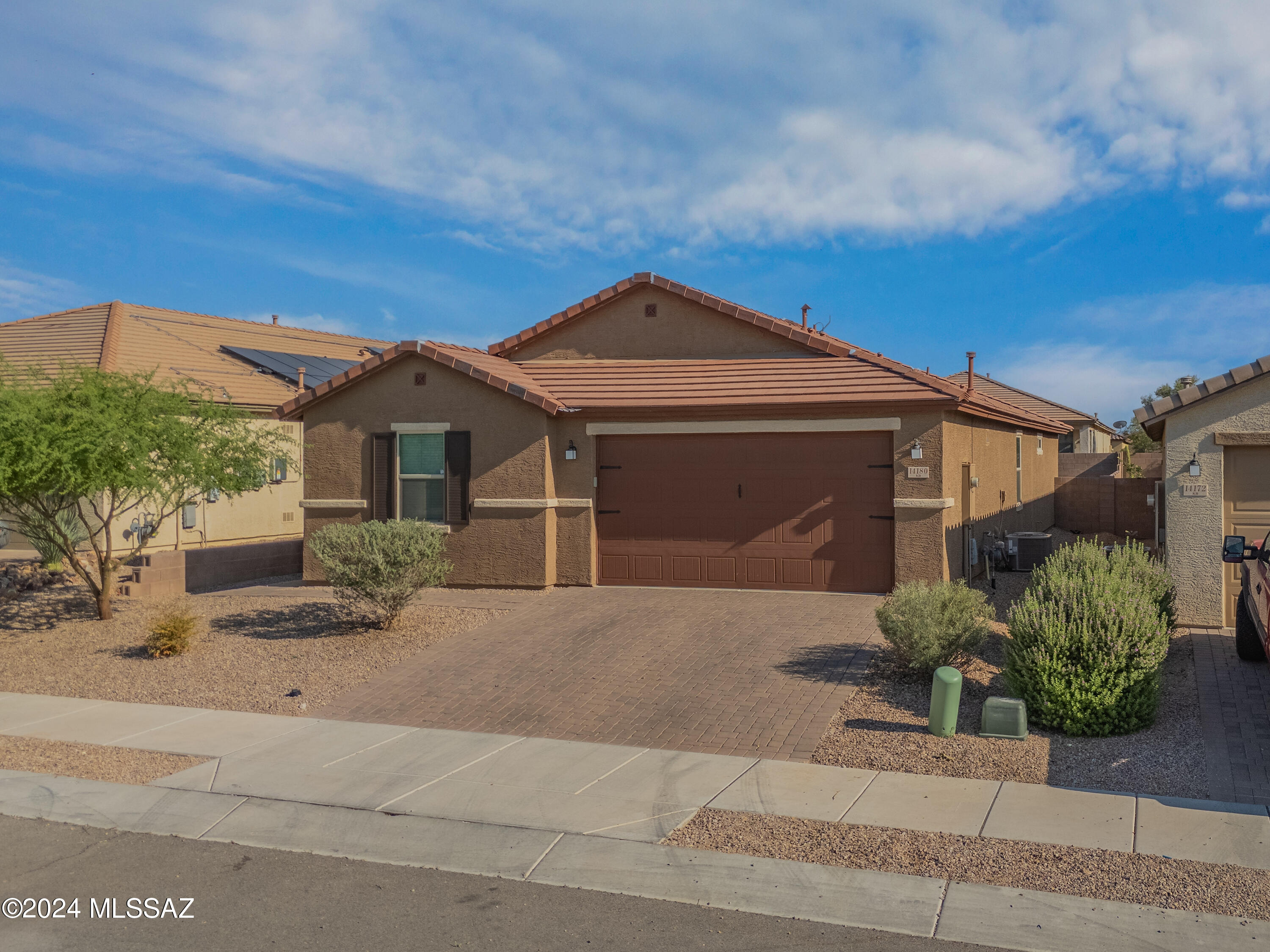 Discover an exceptional opportunity in the highly sought-after Rancho Del Lago Community, part of the award-winning Vail school district. This move-in-ready home, nestled on a cul-de-sac lot deep within the community, features a desirable split-floor plan with spacious rooms and 9' ceilings. The interior boasts 8 x 24 wood-look tile flooring throughout and numerous upgrades. The great room concept includes an upgraded gourmet kitchen with crisp white 42'' upper cabinets, soft-close cabinet doors, stainless steel appliances, a 5-burner gas stove, ample prep space on beautiful solid surface quartz counters, and a spacious island with an extended overhang perfect for a breakfast bar. The primary bedroom and bath offer a custom barn door, garden bathtub, separate shower, dual sinks, an executive height vanity, and a generous closet. The large backyard is perfect for entertaining, featuring landscaped areas, a covered patio, a gazebo, turf, and a pre-plumbed gas BBQ stub. Come see this home today!! SEE FEATURED UPGRADE LIST.