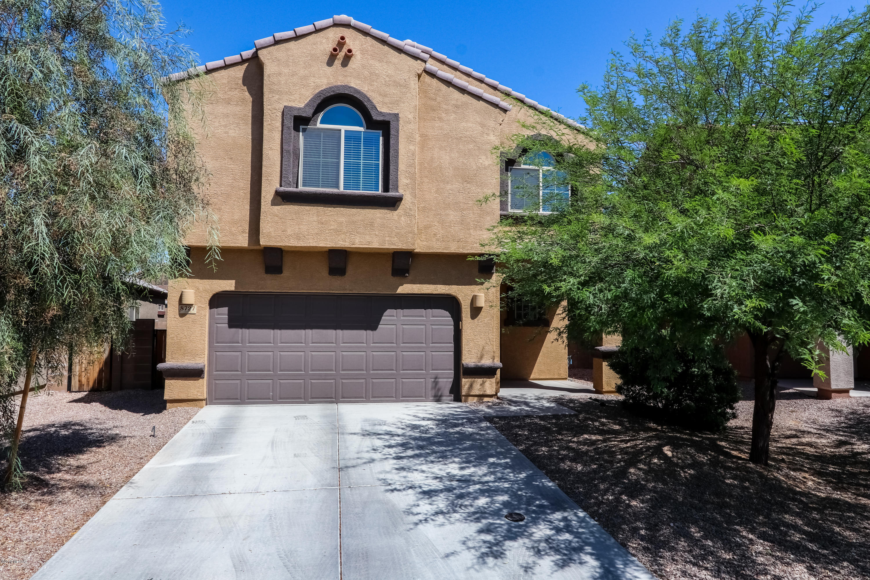 Gorgeous contemporary updates abound in this like new home, located in the desirable Pines subdivision- enjoy the perks of a gated golf community and pool! Rich wood plank tiles on the entire first floor, granite counter tops, and updated cabinets & lighting fixtures. Upstairs you will find a spacious master with ample counter space in bath and dual vanities. Light and bright loft area, upstairs laundry room, and updated hall bath cabinets with high def laminate counters. Retreat to the serene backyard complete with covered patio, pavers, and artificial turf. This home has been beautifully maintained and is ready to be yours!