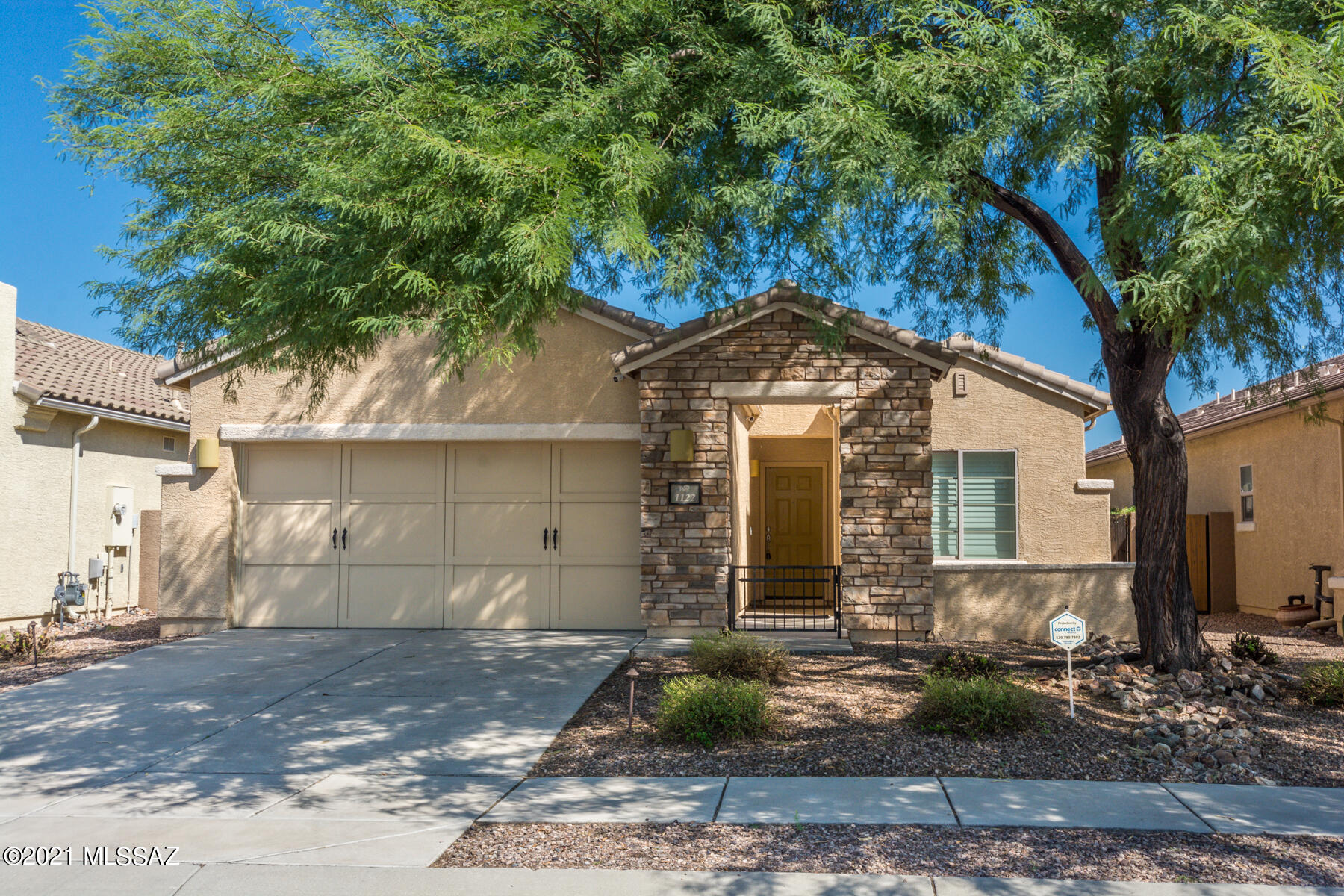 Immaculate 3BR, 2BA home with courtyard in the front and a beautiful mesquite tree. Large great room/dining room area and terrific kitchen with room to cook and bake with stainless steel appliances, granite countertops and designer cabinets. Easy clean tile throughout and plantation shutters on most windows. Big master bedroom and open bath room with a huge walk-in closet! Cover patio out back with paver areas and artificial grass for easy care which backs up to an alleyway for extra privacy. This is a wonderful turn key property that can be moved into so easily. Just bring your belongings!