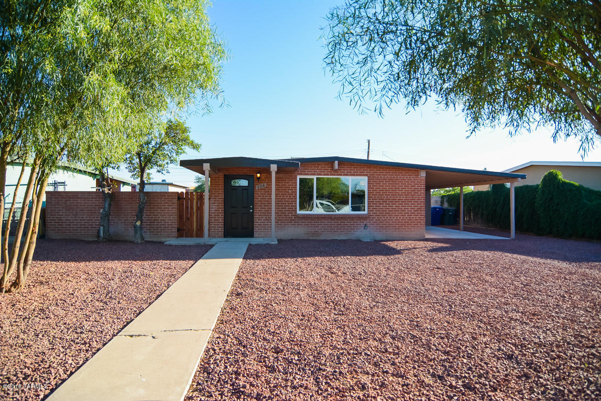 Beautifully remodeled ranch style home. Rich dark wood laminate floors. Modern kitchen with new black appliances.  New custom interior paint.  New central A/C system.  Dual pane windows.  Nice spacious light filled living space. New upgraded carpet and pad in bedrooms.  Nice large walled back yard . Upgraded door hardware and light fixtures.  Spacious carport. Professionally landscaped front yard. This home shows beautifully.