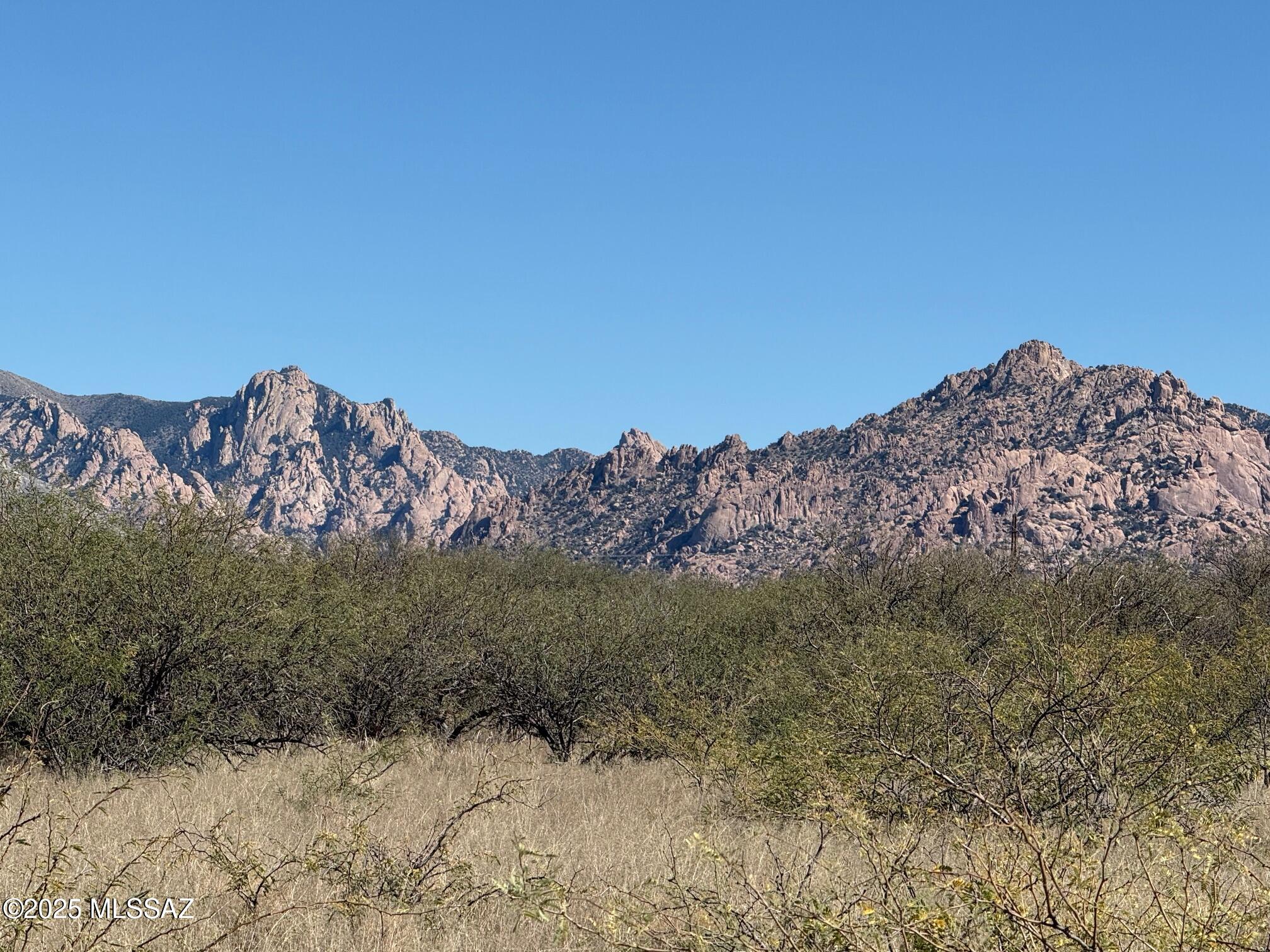 45 acres near the base of the beautiful Dragoon Mountains in St. David, AZ with panoramic views. Located in the approximately 11,000 acre Dragoon Mountain Ranch Subdivision that has 36 acre minimum lot sizes that cannot be split. Here you can enjoy peace and quiet, star gazing at night, hiking and horseback riding throughout and private access to the Coronado National Forest for additional trails, rock climbing and dry camping. The 4000+ elevation provides cooler temps in the summer than nearby Benson and Tuscon. This lot features natural grassland and mesquite trees and underground electric and telephone is available at the road.