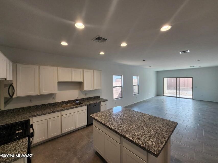 Now selling in Casas Del Cerrito, the most affordable new homes on the East side of Tucson. Come see our Parker floor plan! 5BR and 3 BA home. Included with this home are white cabinets, Stainless Gas Range, Dishwasher and granite countertops in kitchen and baths. Raised panel doors, and much more! There are too many awesome features to list them all, you have to see it! The open floor plan and incredible kitchen are sure to grab your attention in this plan. This home will be ready soon! Brand new construction by DR Horton, America's Builder & an Energy Star Qualified Home which will save you money on your utility bills every month! Builder warranty included.