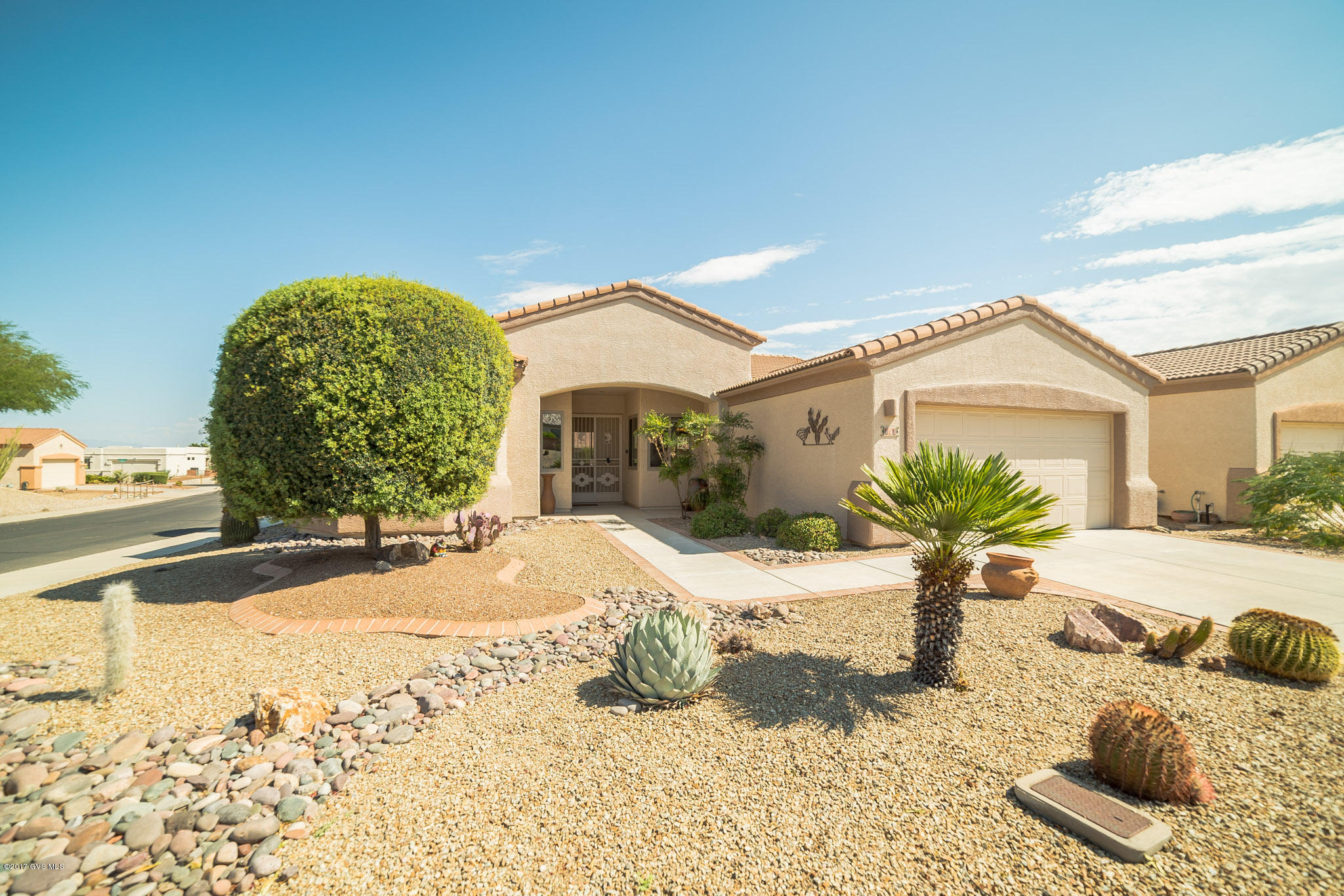 Ideally located in Las Campanas, this lovely home's entire interior was recently painted. One step inside and you'll be SOLD. The open floor plan is perfect for entertaining family and friends or just for the two of you. Great room has a built-in entertainment center and the den has a trey ceiling. Big laundry room has space to do hobbies or whatever you decide. In the guest bedroom there is a bay window. Master suite has built-ins in one of the closets for those of you who want it to be organized. There is a double sink vanity in the master bath as well as a soaking tub and walk-in shower. Easy care landscaping means you'll have plenty of time to enjoy all the amenities that Green Valley offers. And, yes, there is even a view of the mountains.
