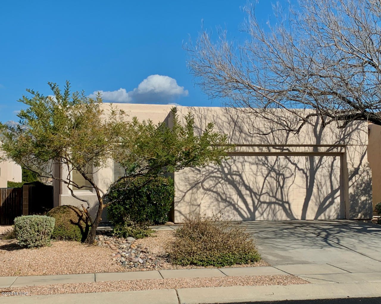 Three bedroom Two Bath Contemporary in popular gated Rancho Esperero. 1380 sq ft floorplan built in 2000 by A. F. Sterling features 9 foot ceilings and Great Room with gas fireplace. Ceiling fan lights throughout. HVAC system installed July 2018 with new 410A Coolant. This lovely community features 3 pools/spas with mountain views. Located near Sabino Canyon/Tanque Verde. Short walk to Udall Park recreation, shopping, banks & restaurants. Monthly HOA of $130 covers front yard landscaping, common areas, gates & TPD security patrol.