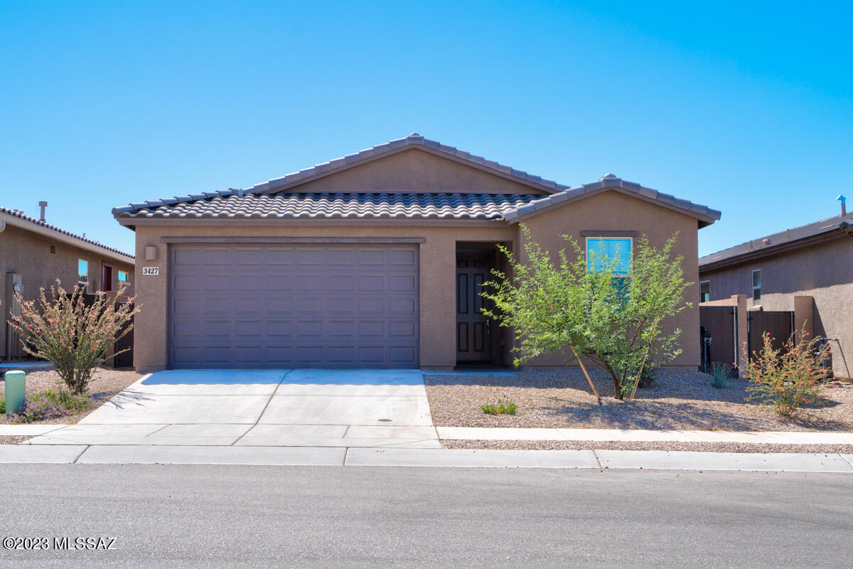 This spacious and well-maintained home features a split floor plan with four bedrooms and two bathrooms. An open concept living area allows for easy entertaining with friends and family. The property boasts a paver back patio and stunning mountain view, providing a peaceful and serene backdrop for your daily life. The east-west facing lot ensures plenty of natural light throughout the day, creating a bright and inviting atmosphere. Washer, dryer, and refrigerator are included. Agent/owner