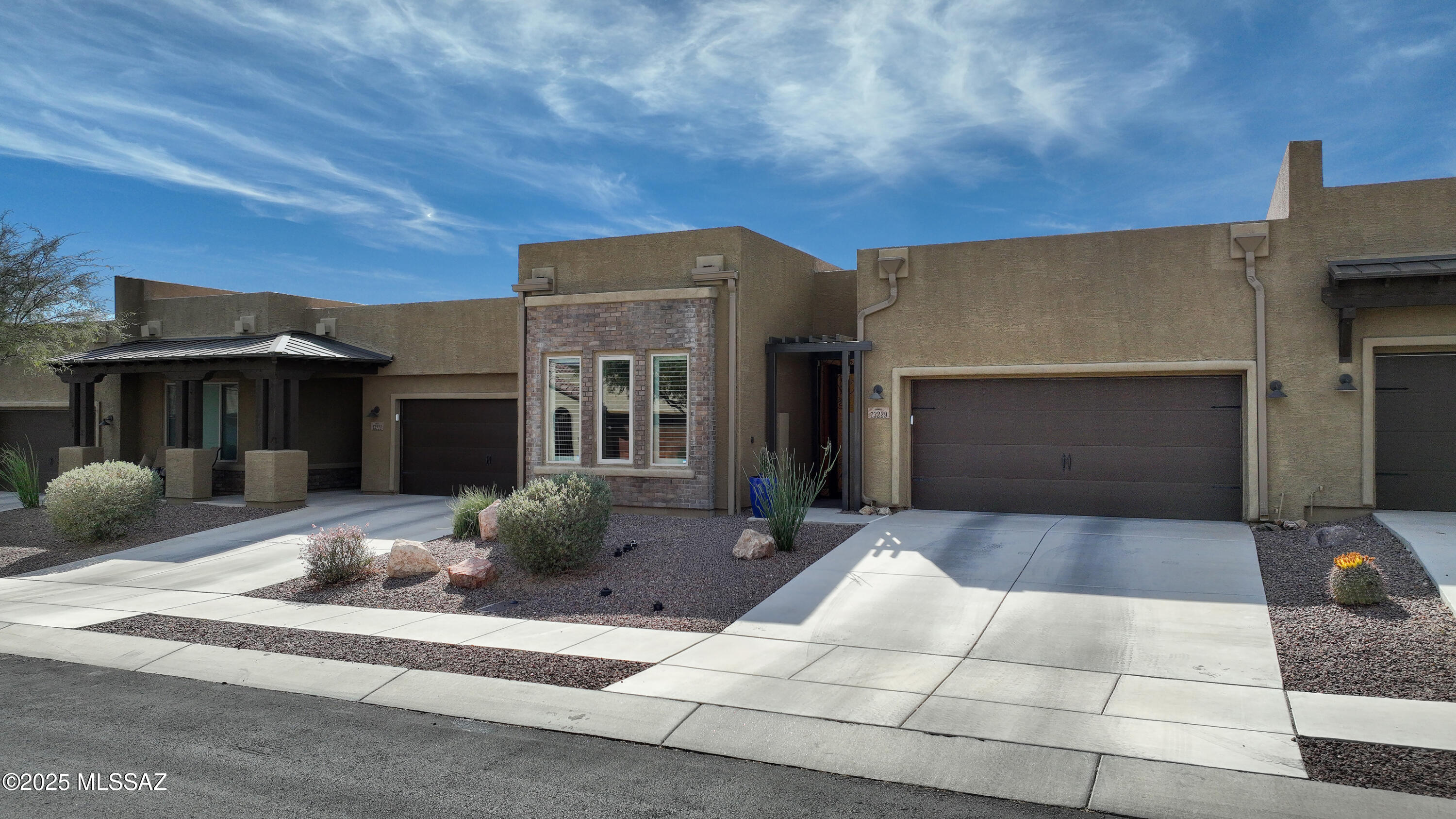 Highly Upgraded Home in Gated Ridgeview Community. Includes rare detached Casita! This is a 2 BR, 2.5 Bath home w/office or den. Private courtyard entrance with lockable gate. Open great room & kitchen with quartz countertops, upgraded cabs and tile floors. All appliances stay. Dining area as well as breakfast bar. Laudry room with new washer-dryer. Across from property is an incredible pool/spa/firepit w/breathtaking views of Catalina Mountains. Garage has Epoxy Floor.
