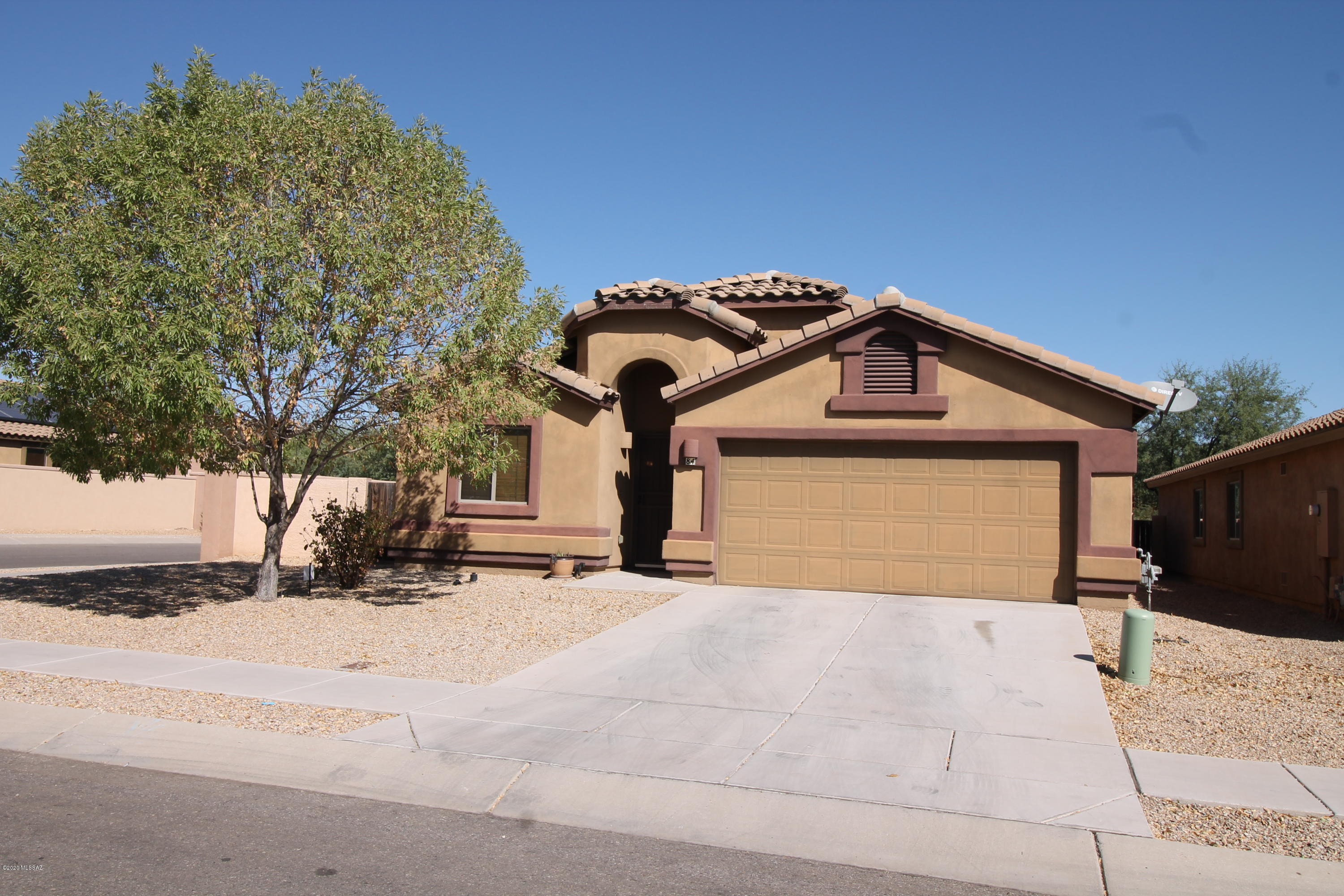 Come see this gorgeous move-in Ready 4 bed 2 bath home in Presidio at Rancho Sahuarita. Minutes from I-19. You are greeted by a formal living and dining room when you walk into the house. Passing down a hallway you enter a wonderful cooking kitchen with island and breakfast nook, plenty of room for entertaining and gathering. Newer paint job throughout house. Large lot corner lot, blank canvas in back yard to make your own.  This community has lots of activities for the family, spend a hot summer day at the splash park or take advantage of the jogging trails, and basketball court.  Only one neighbor east of you, no neighbor behind or on the west side only one neighbor on east side.  Property is conveniently located near shopping, schools and airport. This home will not last contact us now!