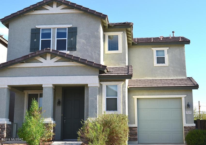 Convenient East side location. This 3 bd 1.5 ba two story built in 2008 has an open floor plan with neutral interior paint and carpet.  Upstairs are 3 generous bedrooms, a shared bath and large laundry room.  Downstairs you will find a spacious family room and dine-in  kitchen. Cherry cabinets and up graded stair rails provide thoughtful accents. Stainless appliances included.  1 car garage w/electric opener. Covered patio and walled backyard for privacy.  Great opportunity to own for the price of a renting.