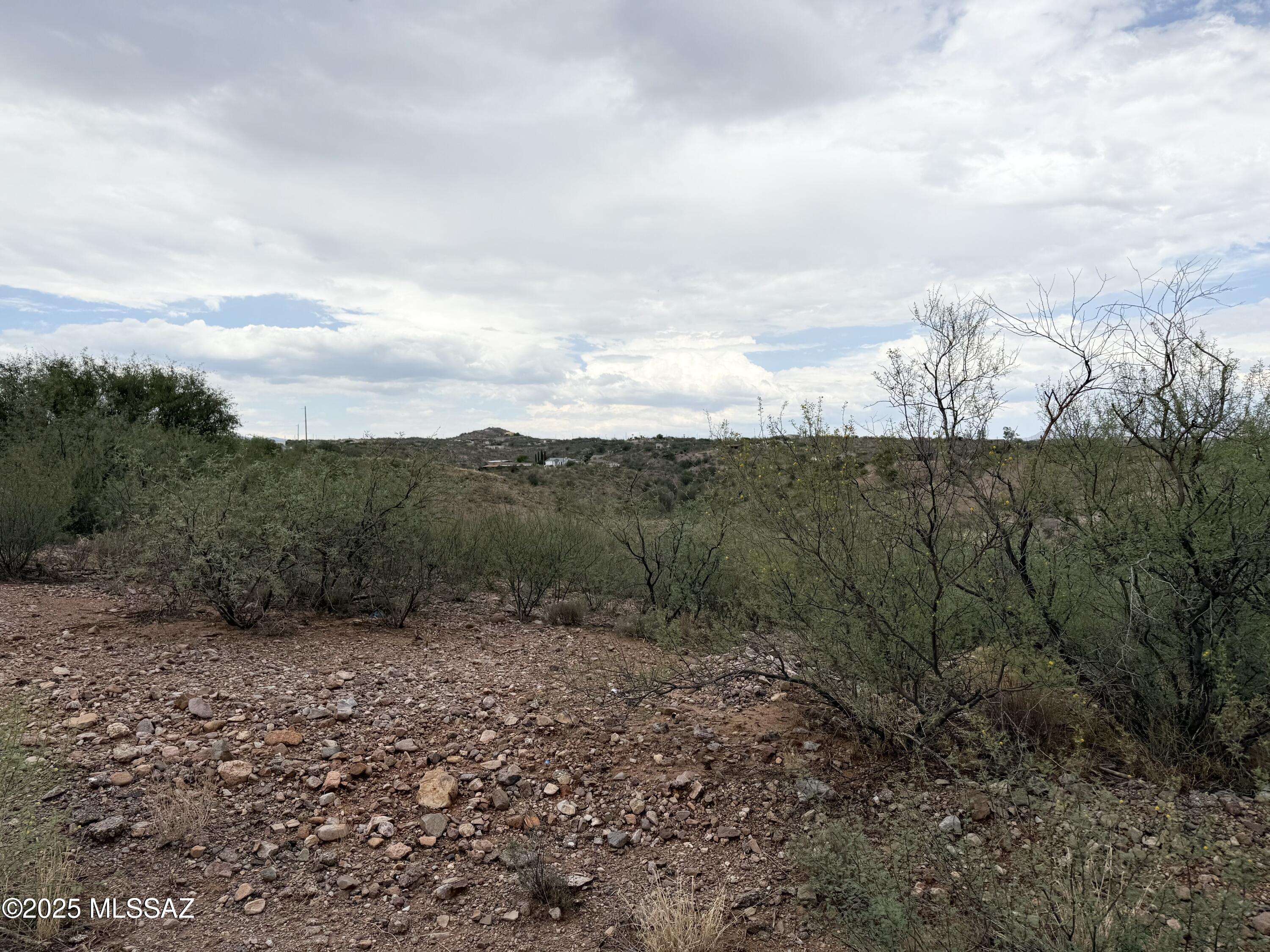 Discover the perfect spot to build your dream home at 204 Paseo Mascota in the scenic Rio Rico Ranchettes. This spacious 0.6-acre lot offers stunning mountain views and the privacy of having no rear neighbors. Enjoy the freedom of no HOA, giving you flexibility in design and use. Located in a peaceful area with a rural feel yet close to local amenities, this property combines tranquility with convenience—an ideal setting for your custom home or future investment.