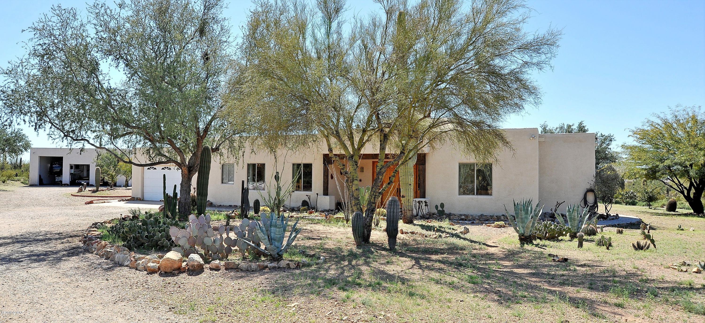 This one of a kind AMAZING property provides privacy & a rural lifestyle while being within a half hour commute to town. This home sits on 4.15 peaceful HIGH DESERT acres, a lovely southwestern style custom built home w/ beautiful knotty alder doors throughout, granite kitchen, AND GARAGES/WORKSHOP of your dreams! An extra large two car garage is attached to the home for everyday parking needs BUT wait til you see the rest! A 6 plus car & RV garage/workshop AND a one car workshop/garage. All of this located
in a peaceful & tranquil setting w/ amazing sunrises & sunsets. This is a MUST SEE beautiful property. The entire lot is fenced in & there is a remote controlled gate for more privacy. It is truly exceptional!