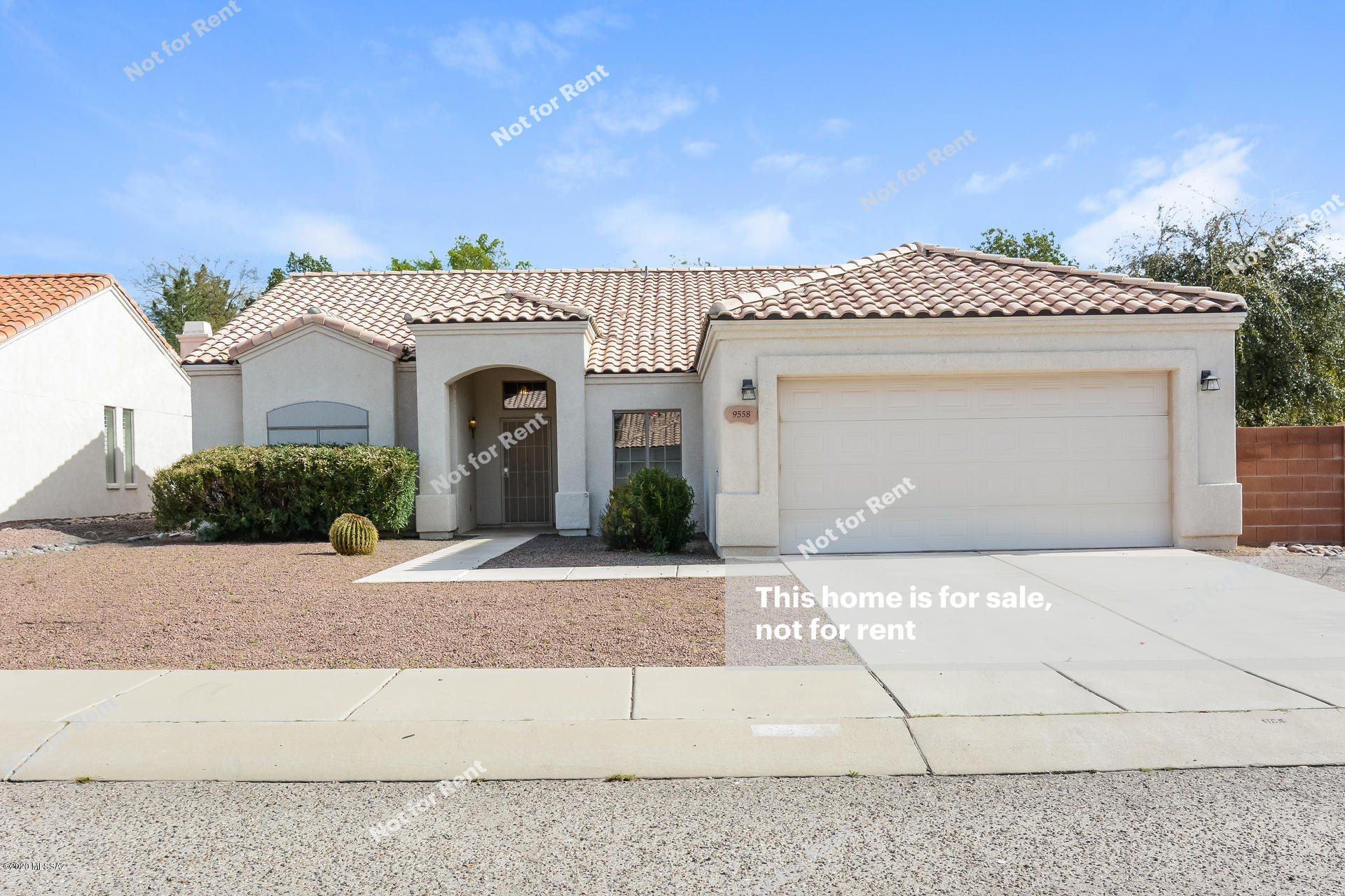 This Tucson one-story home offers gas heating, vaulted ceilings, a breakfast bar, a walk-in master closet, master bath with dual sinks and separate tub and shower, a fireplace, a covered patio, and a two-car garage. This home is vacant and cleaned regularly.