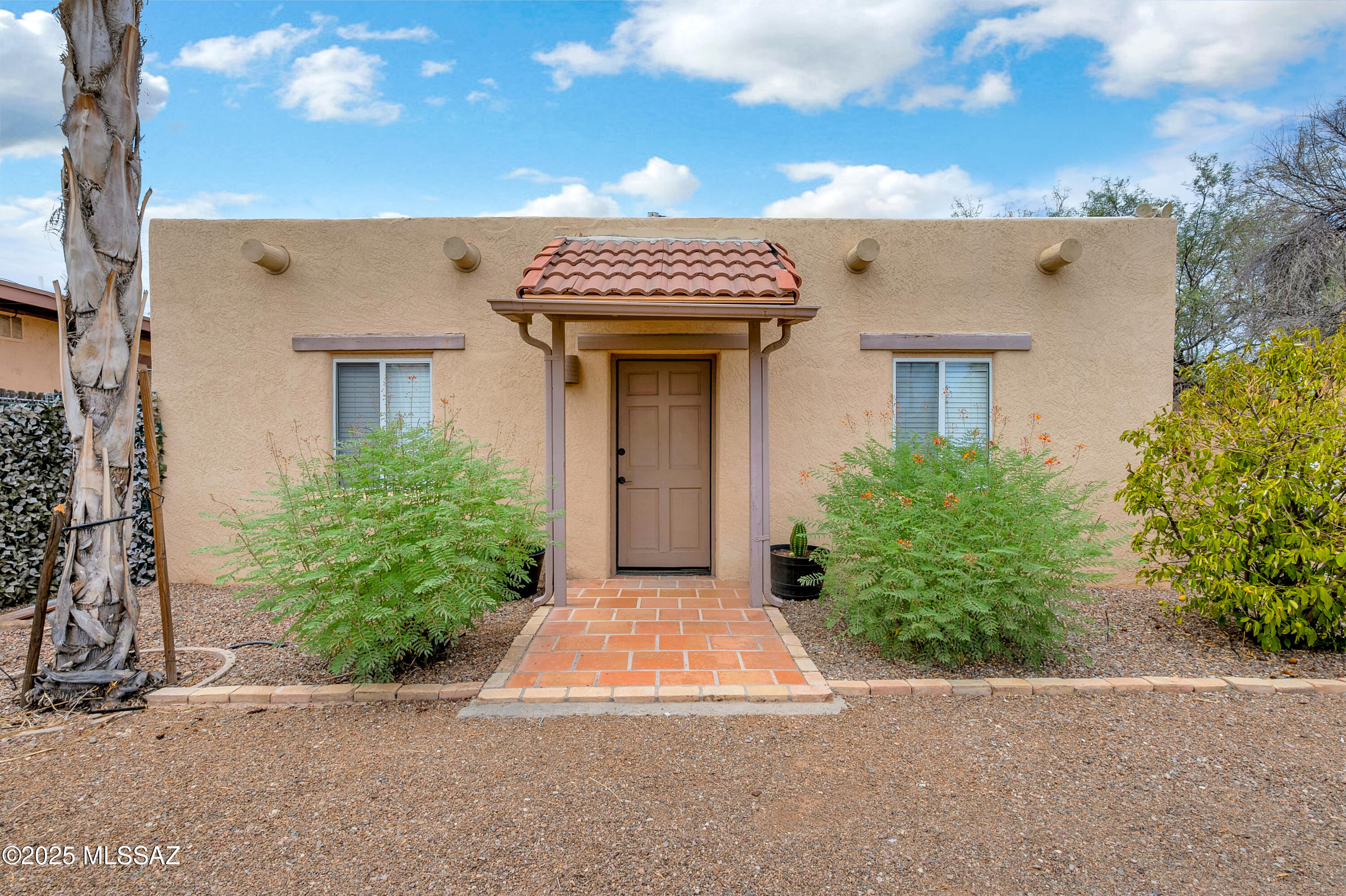 Price range listing. Seller shall consider offers between $460,000-480,000.00. Price Reduced. Fabulous location close to the University Of Arizona and all mid-town activities. Three bedroom two bathroom approximately1413 square foot front unit A, tongue and groove wood ceilings, all tile floors and updated kitchen and laundry closet. One bedroom, one bathroom approximately 600 square foot attached rear unit B, with kitchen and its own laundry facilities. Large lot zoned R-2 potential to add additional unit or ADU, buyer shall investigate.