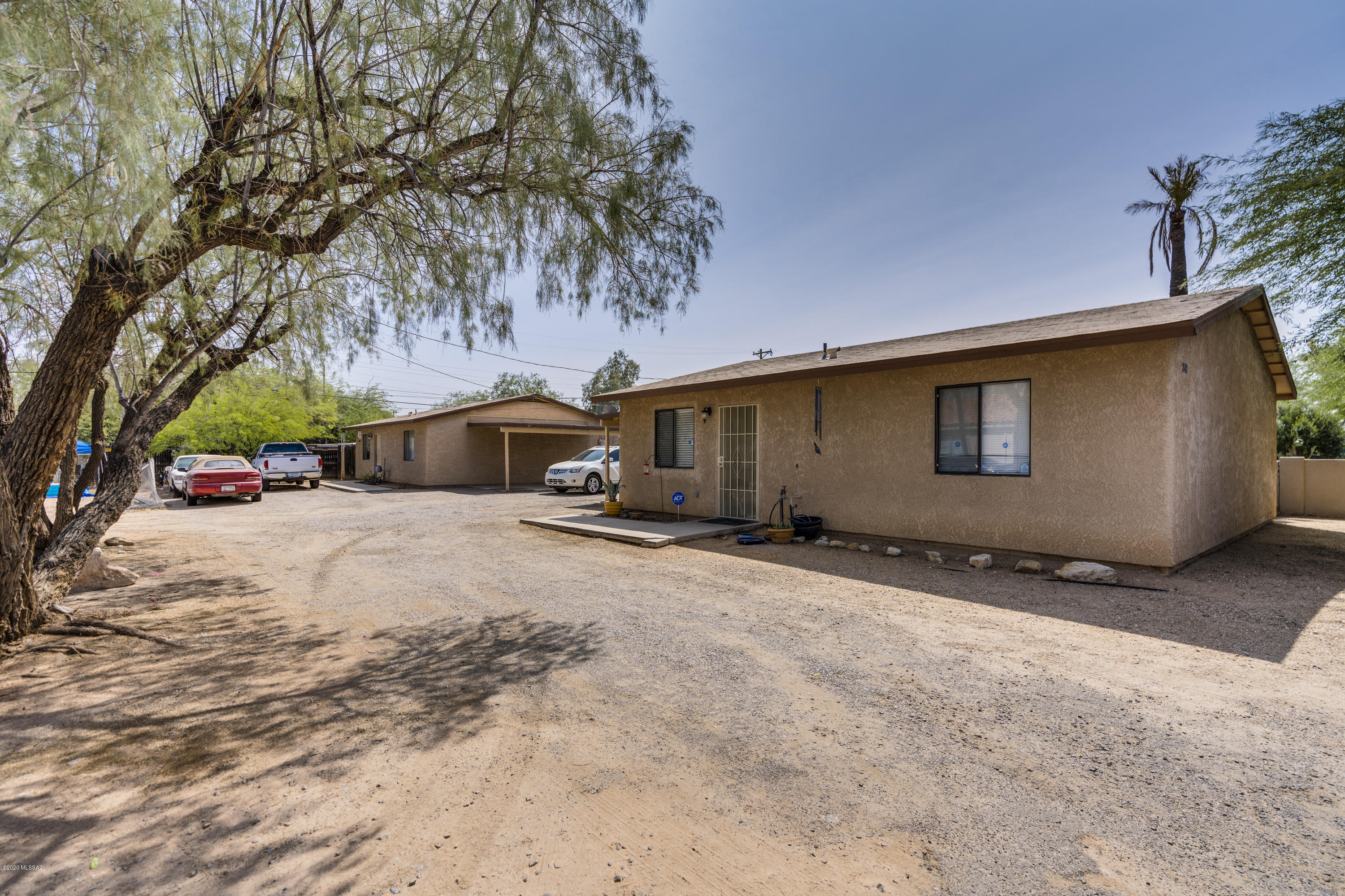 Wonderful investment opportunity! Two DETACHED homes: individually metered, 912 sq. ft. each with 2 bedrooms, 2 bathrooms, indoor laundry room, a/c, ceiling fans, walk-in pantry, attached single car carport and fenced backyard. There is plenty of room for additional parking too.
