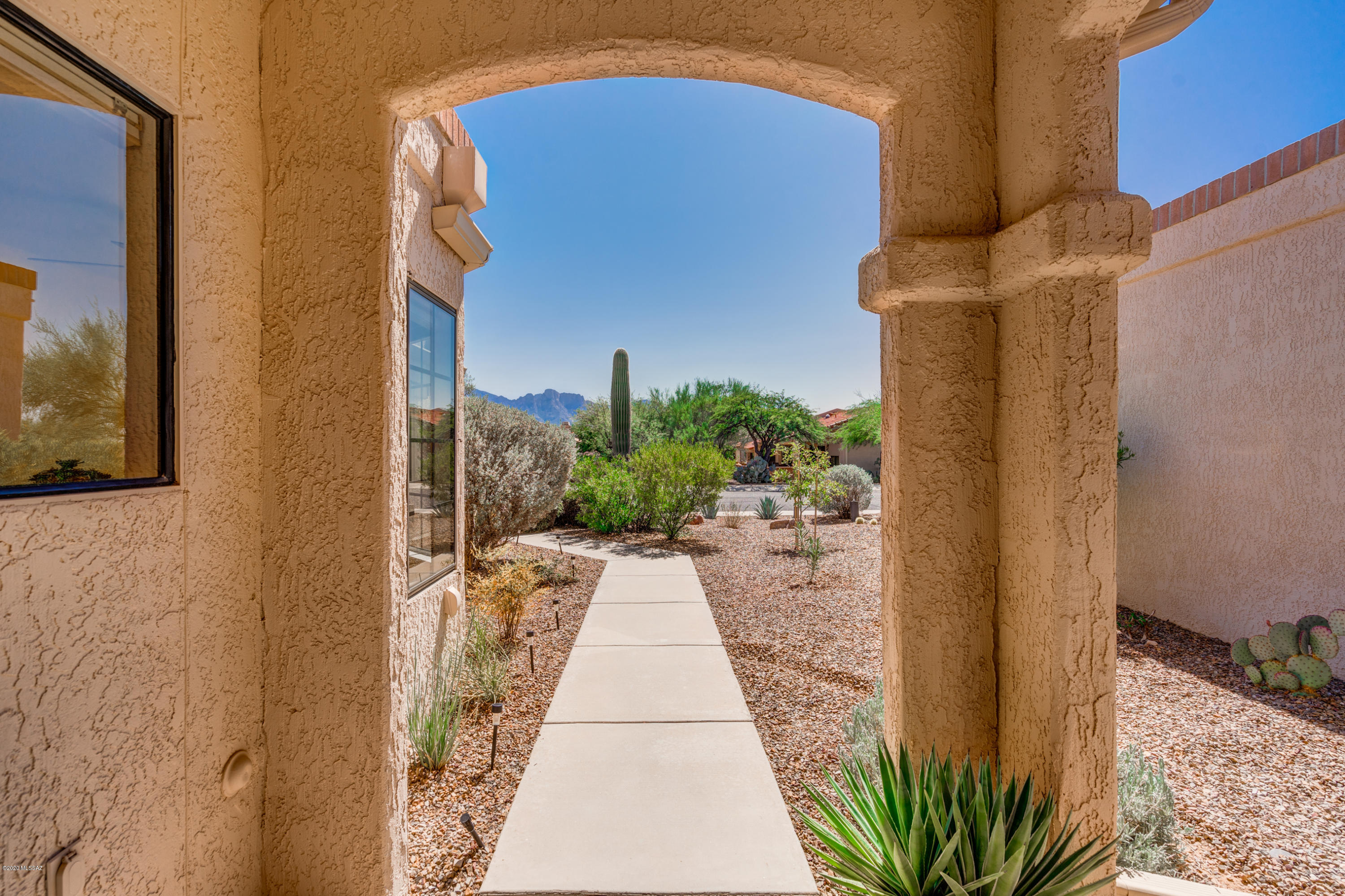 Adorable! Sunny, quaint Sun City Villa/TH with a small, private patio & nothing behind except natural desert, golf course, sunset, & endless parade of Arizona's wildlife. Sun floods the until in front while the back patio is always cool and shady. Mountain views from both front & back. Nearly everything is newly updated: HVAC, roof, fridge, DW, range, paint, window coverings & gutters. Carpet new last week! Small office w/desk & extra bed. No outside maintenance - Ember Ridge HOA does painting, roof, termite control, garbage & front yard landscaping – relax without worry or easily lock-and-leave it. Surround yourself with the friendliest neighbors in SCOV – these villas go VERY quickly!