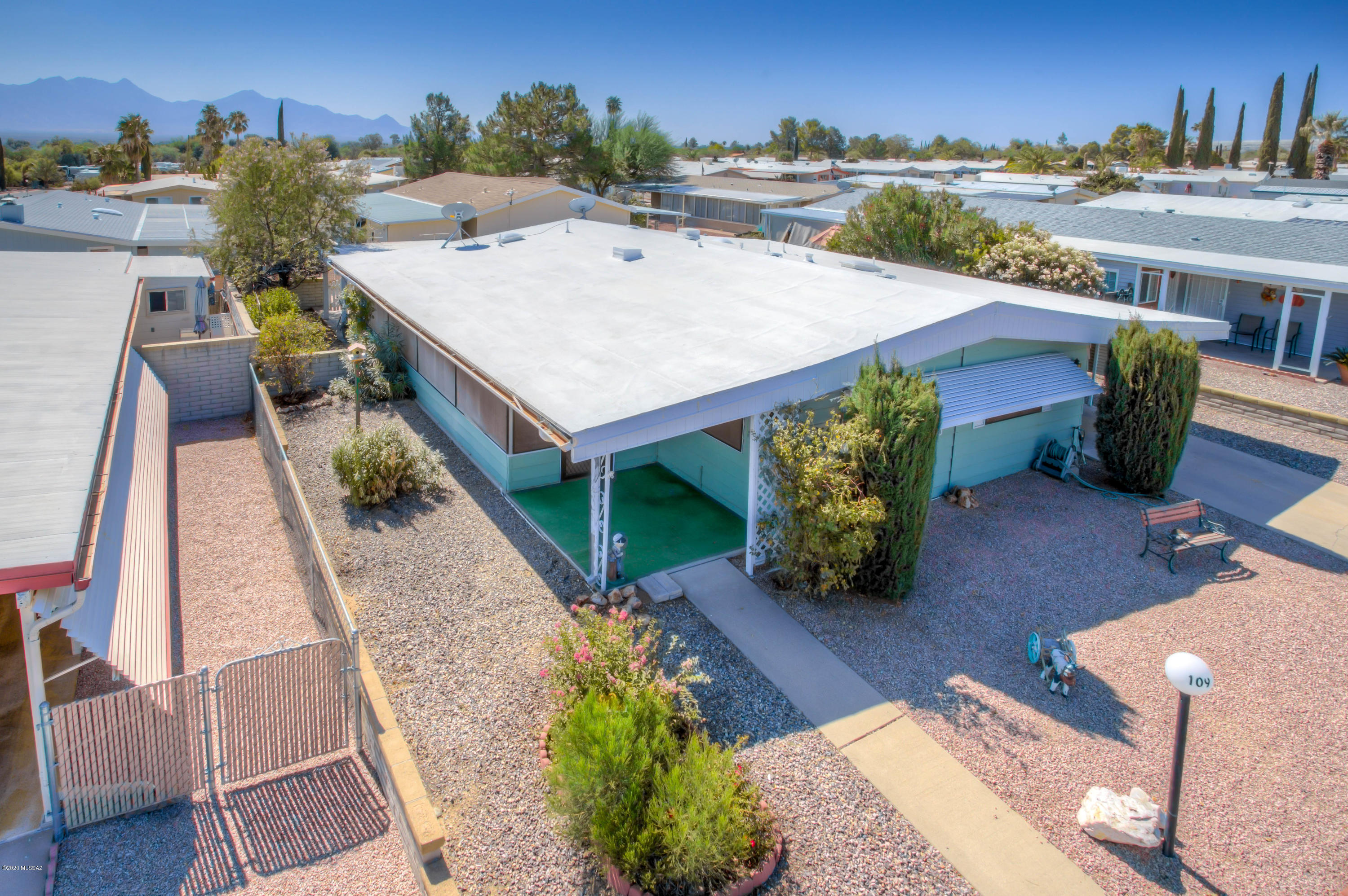Nice Furnished 2 Bedroom 2 Bath Home at an Affordable Price. Includes Large Arizona Room with Lots of Windows. 2-Car Tamden Carport and Workshop/Storage Room Covered Side Patio. Rear Covered Patio and Extended Concrete Patio. HOA includes Clubhouse, Community Pool, Spa, Horseshoes, Shuffleboard, Library, Pingpong, and More!