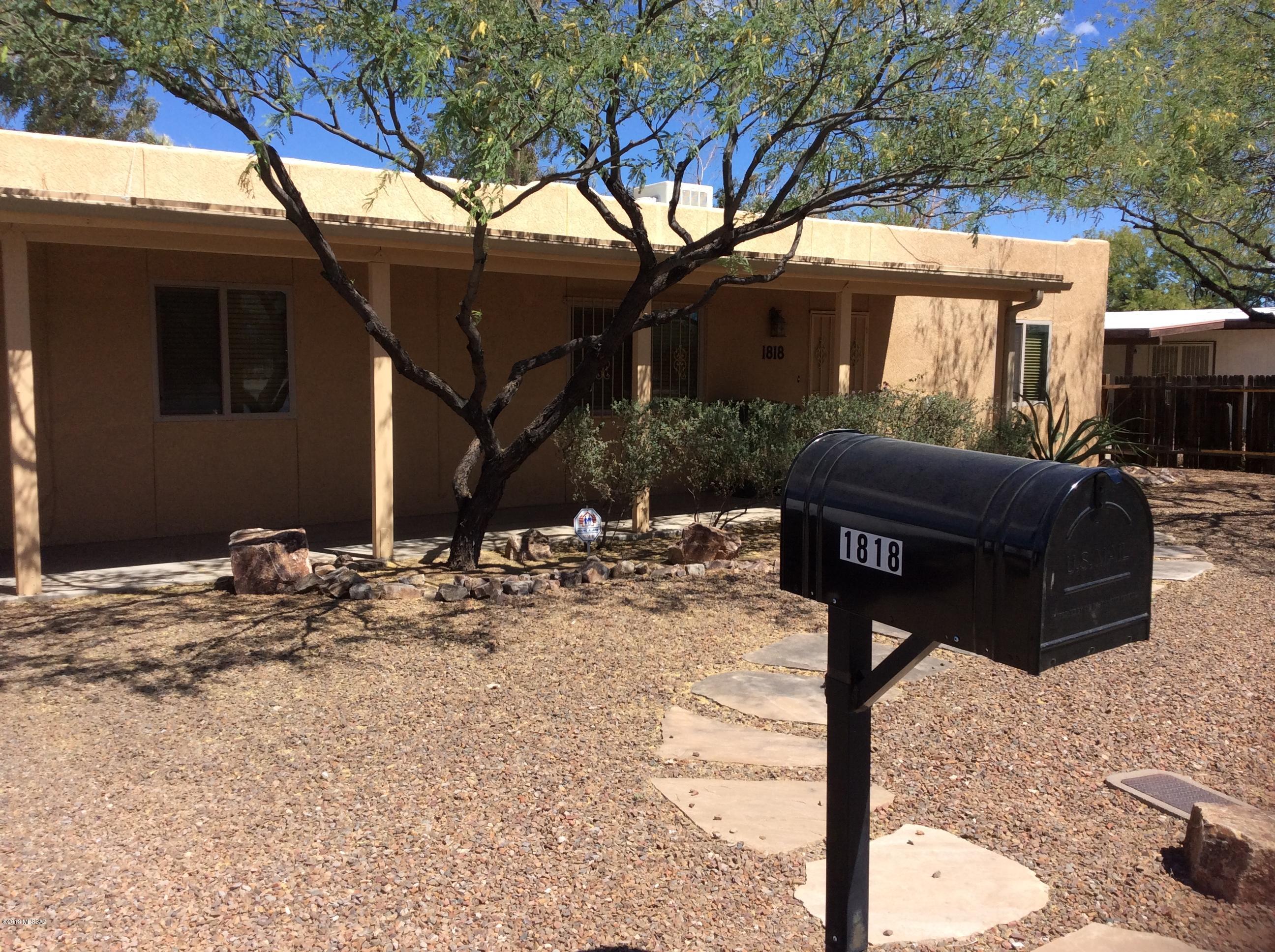 Newer home centrally located near the U of A campus. Freshly painted interior and all tile floors through out-no carpeting! Modern kitchen including all the appliances, gas fireplace in the living room. Split bedroom floor plan with mirrored closet doors & ceiling fans in each one. Two full baths, washer and dryer and plenty of storage areas, single car garage plus large fenced backyard.