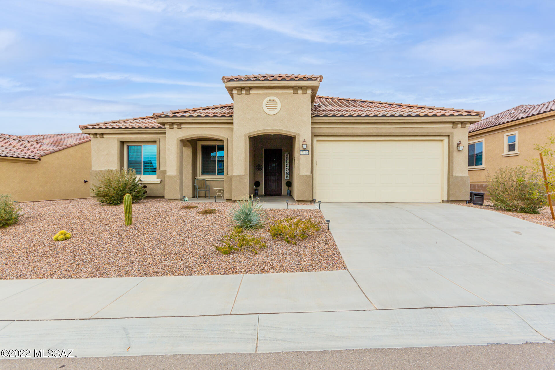 Built in 2020, this ''like new'' 2 bed, 2 bath+den home in the 55+ community of Del Webb at Dove Mountain is now on the market! Come inside to discover a neutral palette, tile flooring, and huge windows letting in lots of natural light. Entertain guests in the great room w/ wet bar. Eat-in kitchen features quartz counters, a plethora of white cabinets w/crown moulding, SS appliances, tile backsplash, recessed/pendant lighting, and an island w/ breakfast bar. The flexible den w/French doors is ideal for a home office. The main bedroom boasts a large ensuite w/ dual sinks, and a spacious walk-in closet. Enjoy relaxing afternoons in the backyard with covered patio, a fireplace, turf, mountain views and plenty of space and privacy. Community offers a req room, pool, and many more amenities.