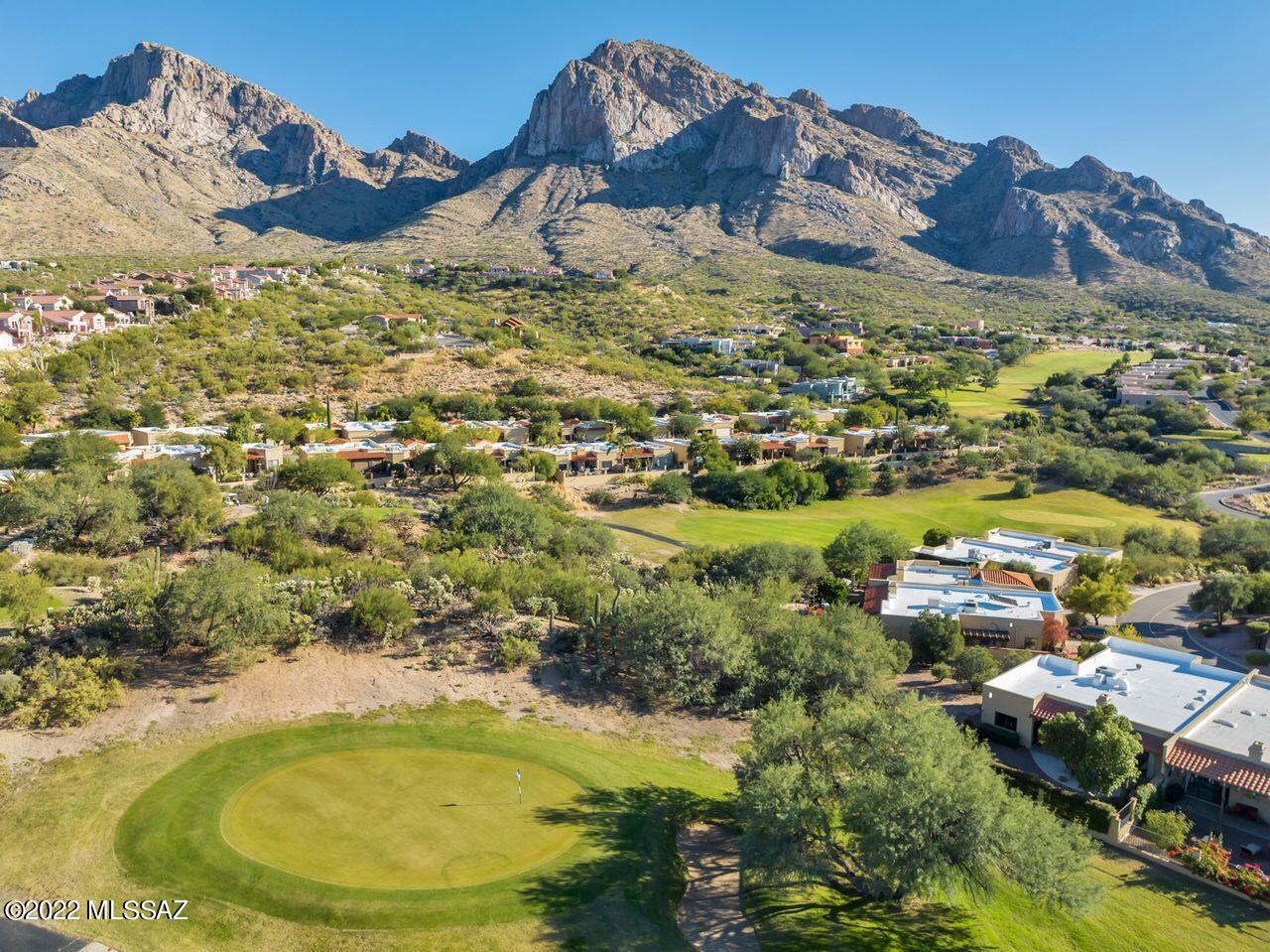 Drive up El Conquistador Way and you will be stunned at the towering view of the majestic Catalina Mountains! Arrive at your new townhome and look out the window, or sit in the private patio of this rare end-unit which backs up to the Hilton El Conquistador Resort golf course, and you will be looking at the same gorgeous Pusch Ridge view! This single story, 1784 sq. ft., 2BR/3BA +den home which features skylights, ceiling fans, a wood burning fireplace, new exterior paint, and new roof coating with a 2-year warranty, is waiting for the next owner to create their own private, Resort ''Staycation''