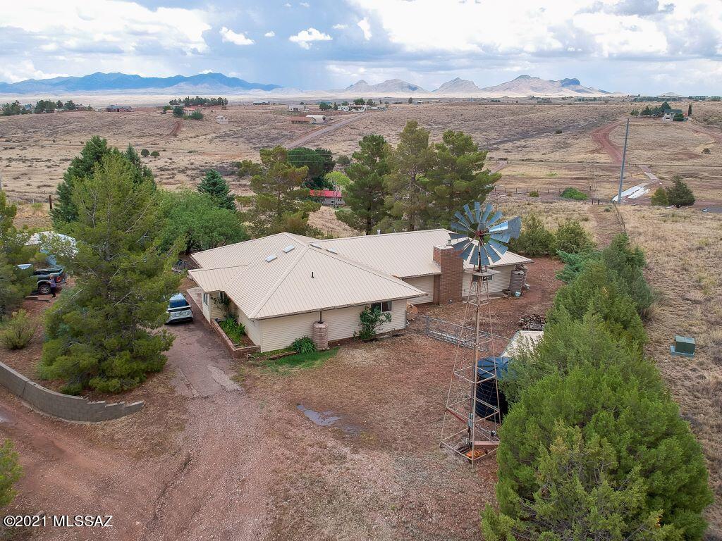 Top of the hill views, 4951 ft. elevation, Evergreen and Fruit trees around the home, Windmill pulls water with back up pump installed. The home has metal siding and metal roof, gutters with 7 water catchments. Large kitchen great room floor plan, with huge master bedroom. Close to winery row with plenty of outdoor activities near by. 
Fruit trees Currently planted : Gala, Granny, Macintosh Apple, 3 Pear trees, Apricot, 2 Aprium. Large shed will not convey.