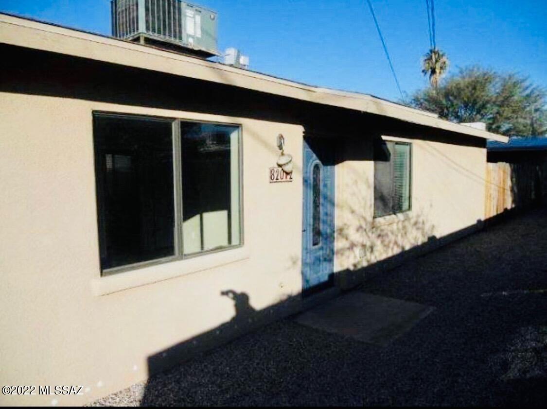Located minutes from the U of A!! Ride your bike to class! These homes are close to an array of nightlife, shopping, downtown Tucson, historic 4th avenue and plenty of popular dining spots! Front house is a spacious 860 sq ft renovated 2 bed 1 bath Classic Ranch style brick home. Cool Saltillo tile throughout the main living areas, neutral paint, enclosed private back yard and plenty of parking! Large bedrooms with additional built-in storage and a quaint walk-through galley kitchen. Back house features: ceiling fans, newer renovated kitchen, and gorgeous stained concrete floors. Private fenced yard with desert landscaping for ease of maintenance. All appliances included with W/D. Plus plenty of parking! Large driveway and private back entry.