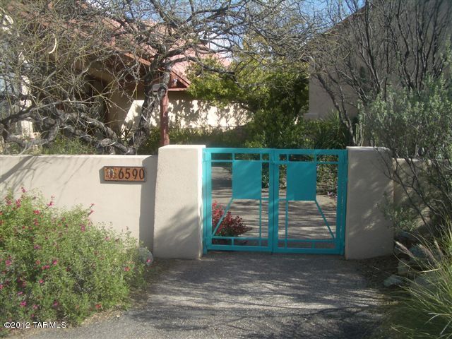 This wonderful contemporary home in Cimarron Foothills Estates is truly unique and a must see. Amenities include souring ceilings, floor to ceiling windows in living room, large kitchen with island and loads of cabinetry & counter space, living room fireplace, loft/den, large family room off kitchen, newer carpet & slate tile entry,  multiple patios, negative edge pool, beautiful artificial turf lawn, spectacular mountain views, and beautiful lush vegetation all around. You will want to see this one. Please contact the listing agents or your own agent to schedule a showing, and let us know if you have any questions regarding this property, our standard lease terms, our rental application requirements, and/or the pet policies for this rental.
