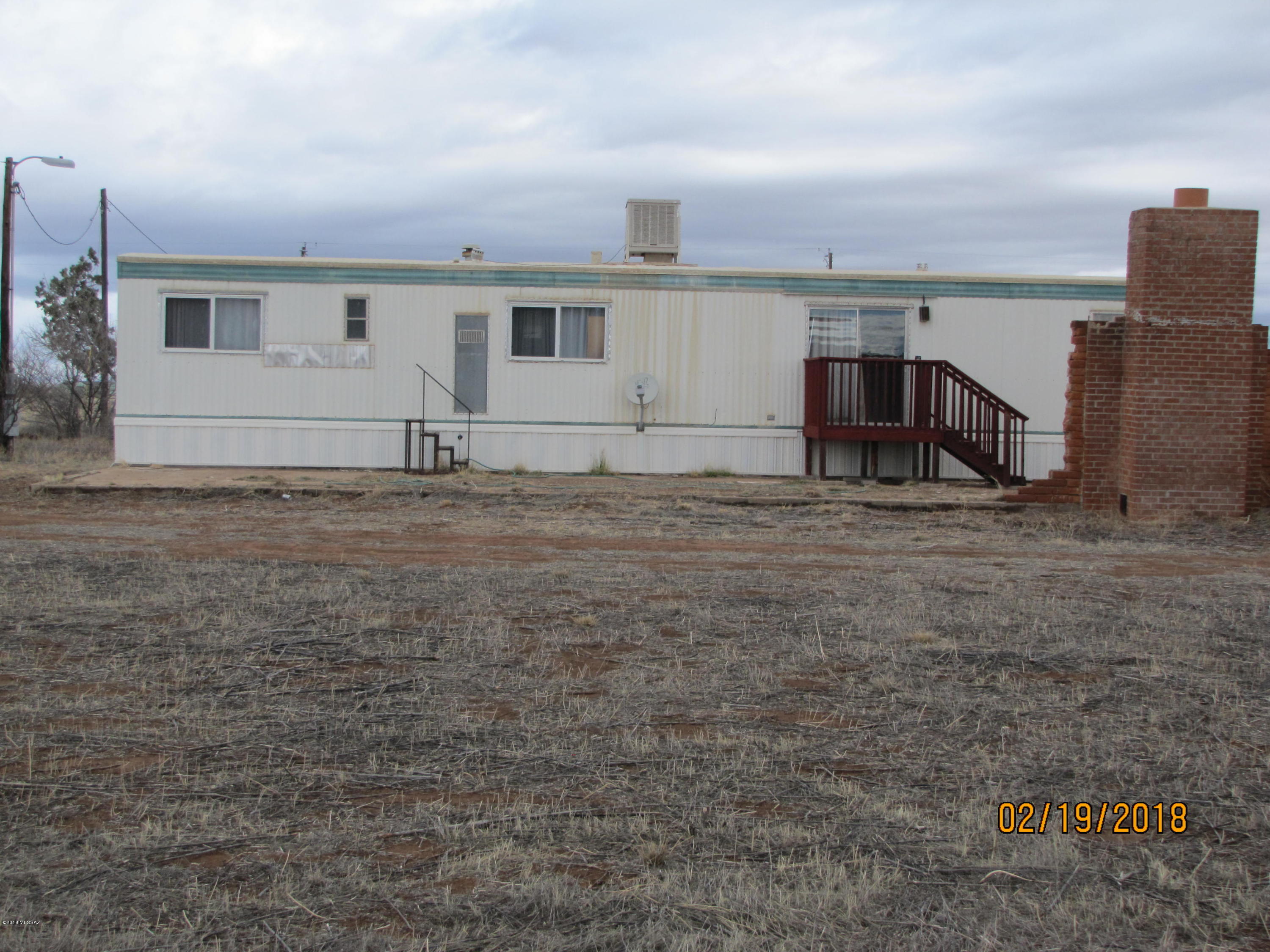 Panoramic rural and mountain views from this 2BR/1Ba home on 3+ac. Private well and 2 storage sheds. Less than 1/4mi off paved road. Chiricahua National Park easily accessible via nearby highway. Rural living yet close to restaurant, gas and convenience store. Propane tank is leased.